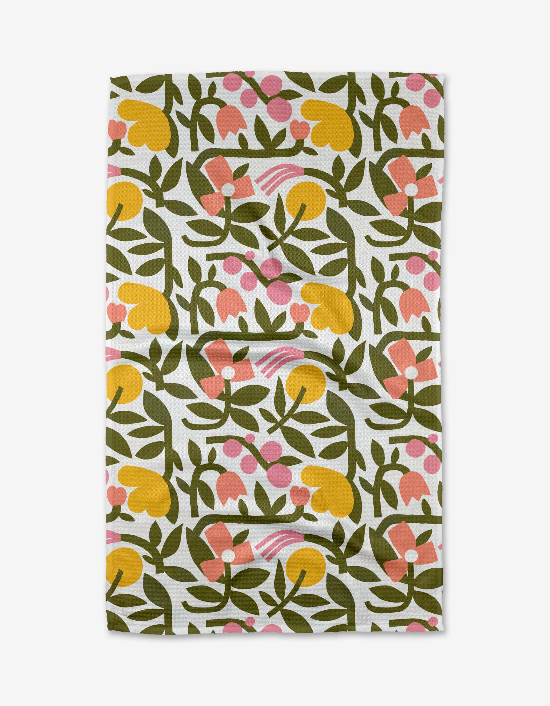 The Lisa Nelson Fresh Vines tea towel features a repeating pattern of yellow, pink, and orange abstract flowers with green leaves on a white Geoweave fabric background. The cloth has a slightly wrinkled appearance.