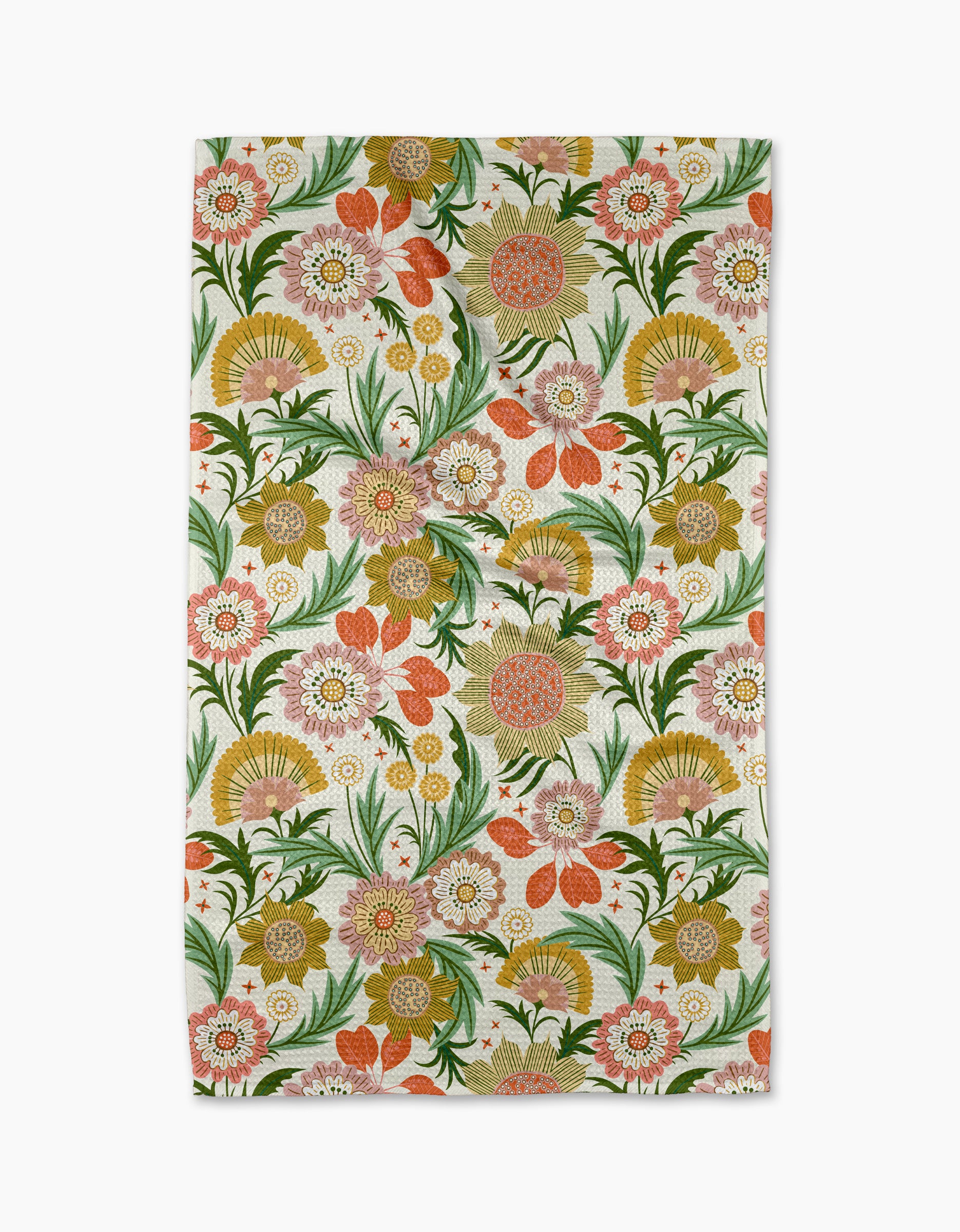 The 'Garden Dreams' tea towel by Rachel Parker features a colorful, vintage-inspired floral pattern with orange, pink, green, and yellow flowers and leaves on a white background, repeating across the fabric.