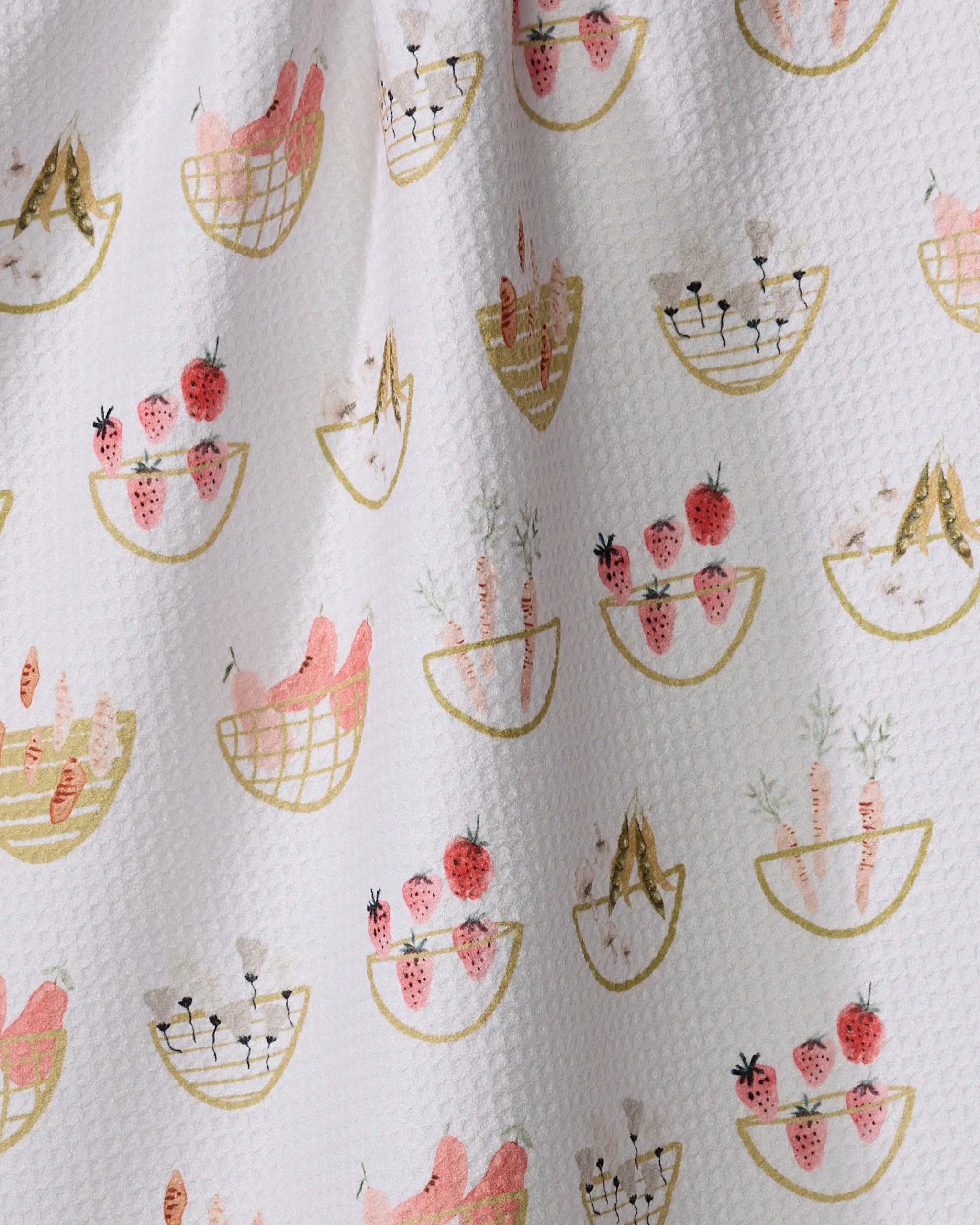 Garden Fresh by Anee Shah features whimsical fruit and veggie bowls on a textured white background in soft pink, gold, and green—ideal for an ultra-absorbent tea towel made from recycled materials.