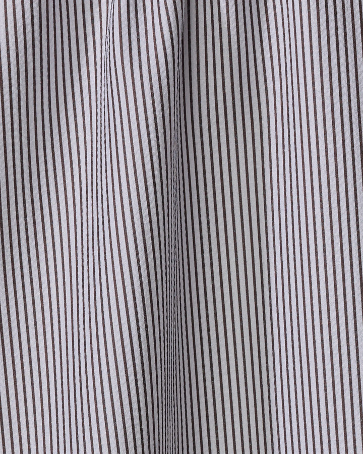 Close-up of The Buy Guide’s Get In Line - Chocolate kitchen tea towel with vertical brown and white pinstripes. Visible texture, seams, and gentle folds highlight its eco-friendly design crafted from recycled materials.