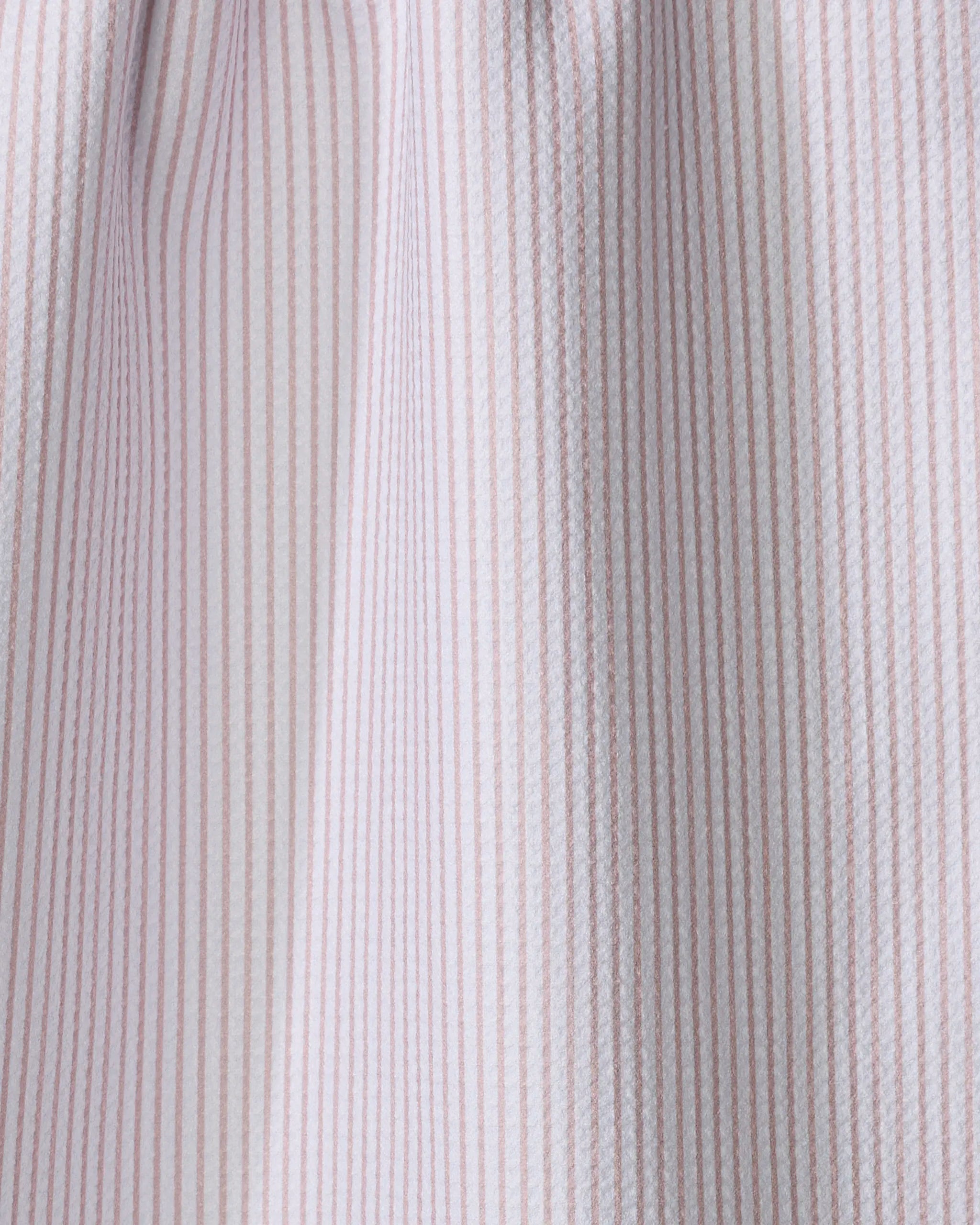 Close-up of The Buy Guide’s Get In Line - Dusty Rose tea towel, featuring thin vertical pink and white stripes on ultra-absorbent, textured fabric, softly draped to show gentle folds and shadows.