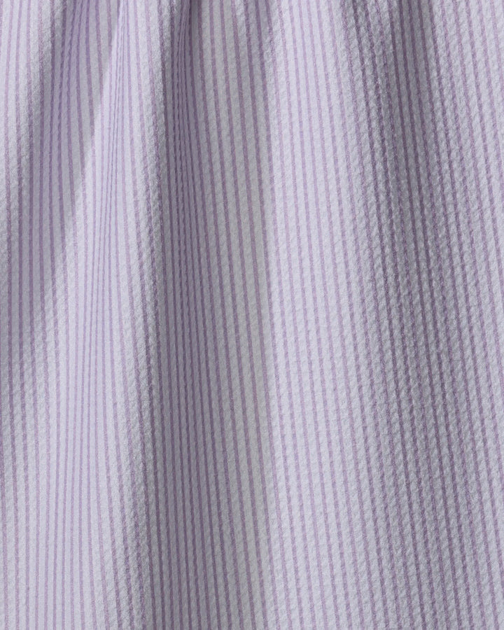 Close-up of The Buy Guide’s Get In Line - Lilac tea towel, featuring evenly spaced light purple and white vertical stripes. Made from quick-drying recycled materials, it has a soft, lightweight texture with a gathered look.