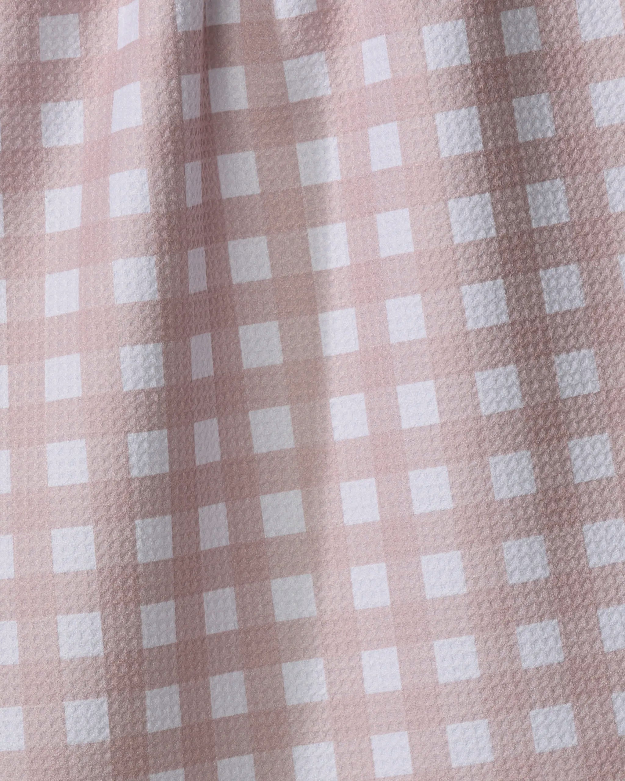 Close-up of The Buy Guide's Gigi - Dusty Rose: a pink and white gingham tea towel with a textured, ultra-absorbent surface and charming grid pattern.