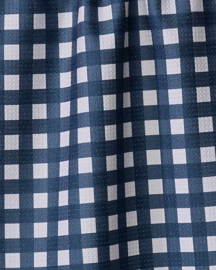 Close-up of The Buy Guide's Gigi - Navy tea towel, featuring a blue and white checkered pattern with textured surface, evenly spaced squares, and subtle folds.