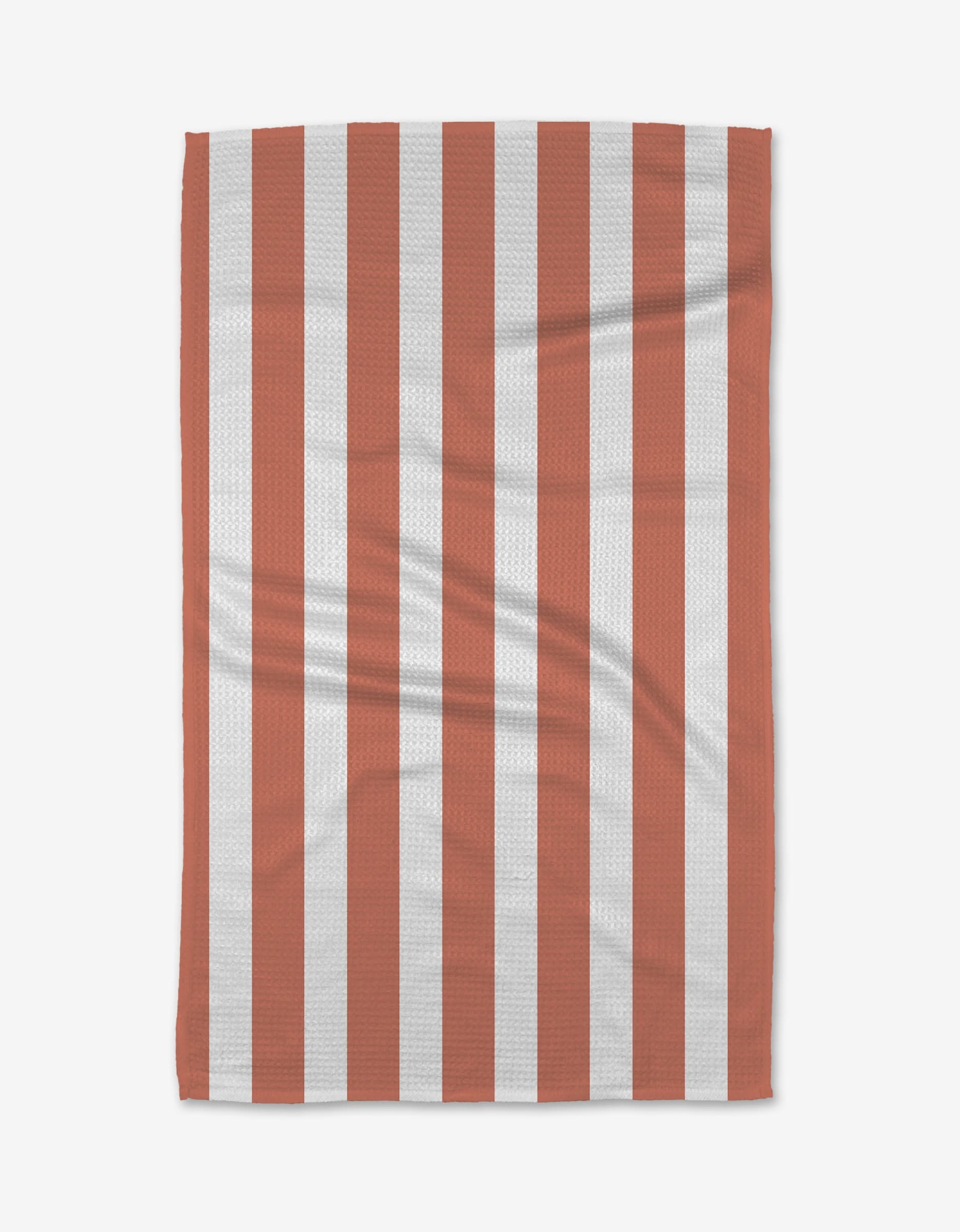 The BetterDays Glow Geoweave towel, made from ultra-absorbent recycled materials, features a simple rectangular design with vertical red and white stripes and visible creases.