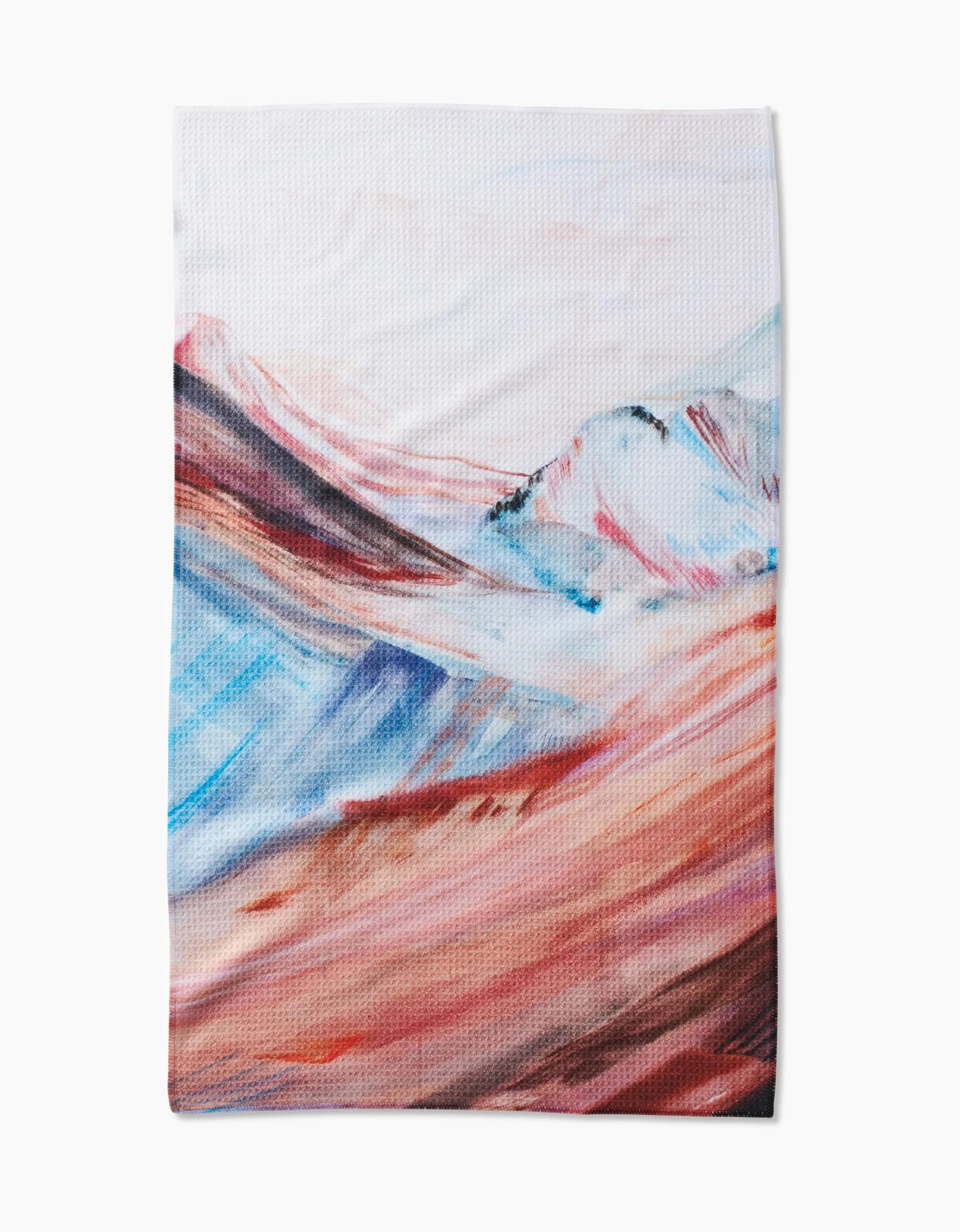 Golden Hour in the Rockies by Kelly Peters features flowing hills and mountains in blue, pink, and reddish-brown on ultra-absorbent Geoweave fabric, creating a vibrant abstract scene on textured white.