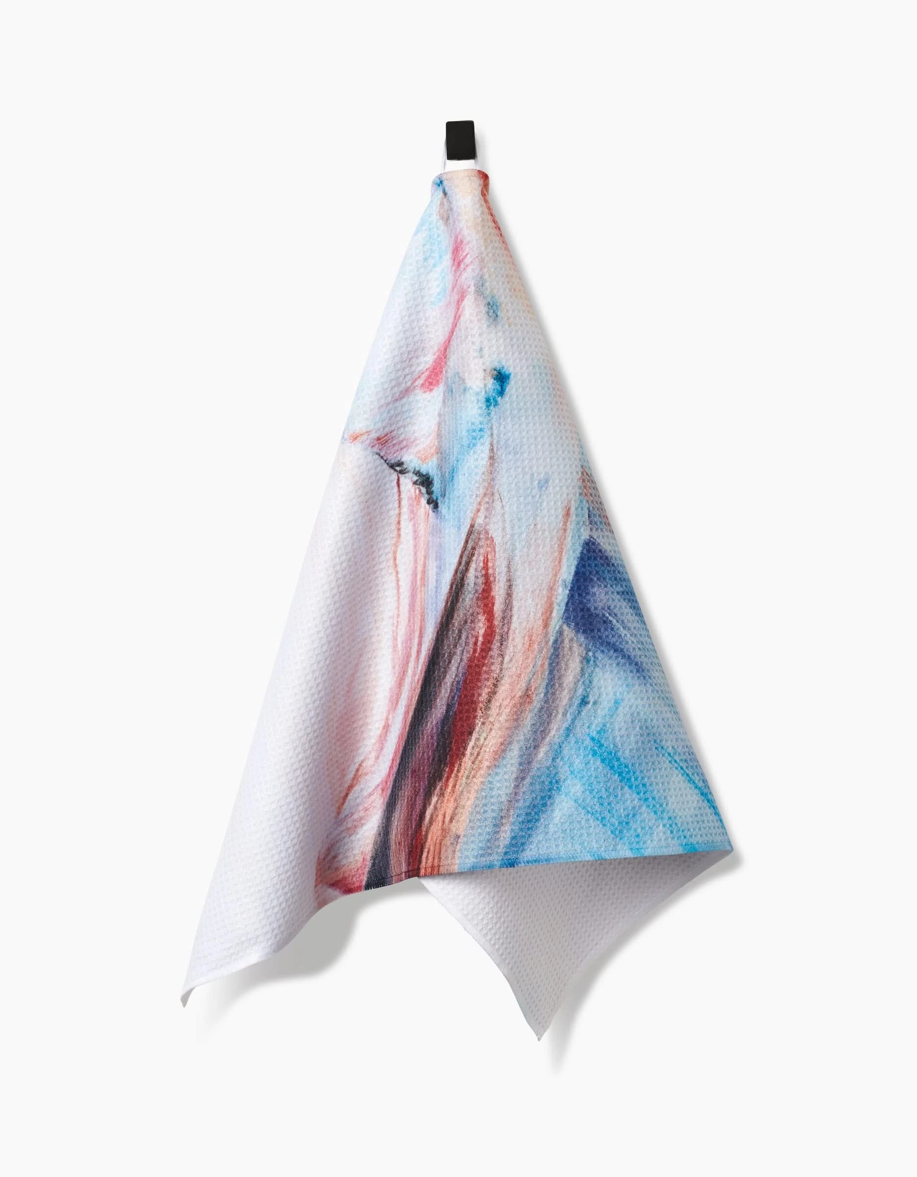 The Golden Hour in the Rockies towel by Kelly Peters features an abstract watercolor design in blue, pink, and red on ultra-absorbent Geoweave fabric, displayed with a black hanging loop on a white background.