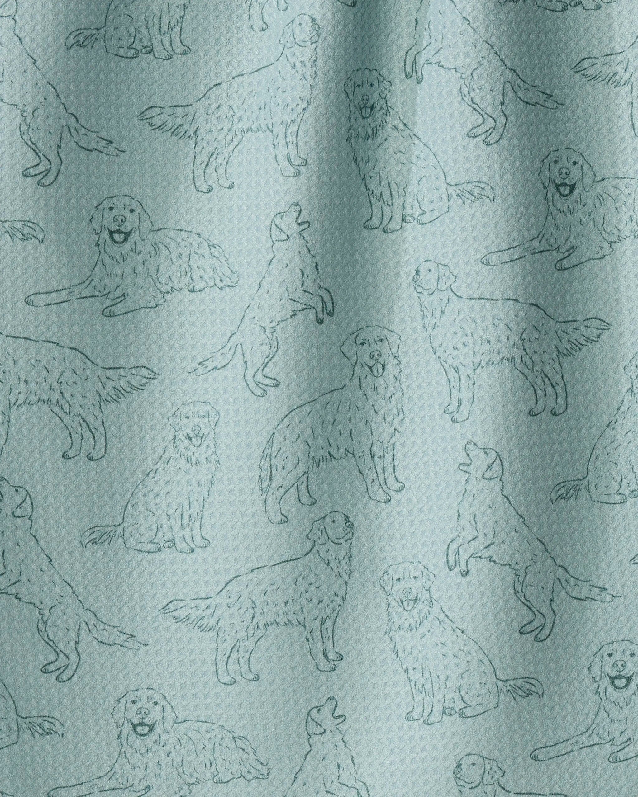 Golden Pups by Geometry features a light blue textured fabric adorned with a repeating pattern of simple line drawings of dogs in various standing, sitting, and howling poses—perfect as a charming kitchen towel crafted from recycled materials.