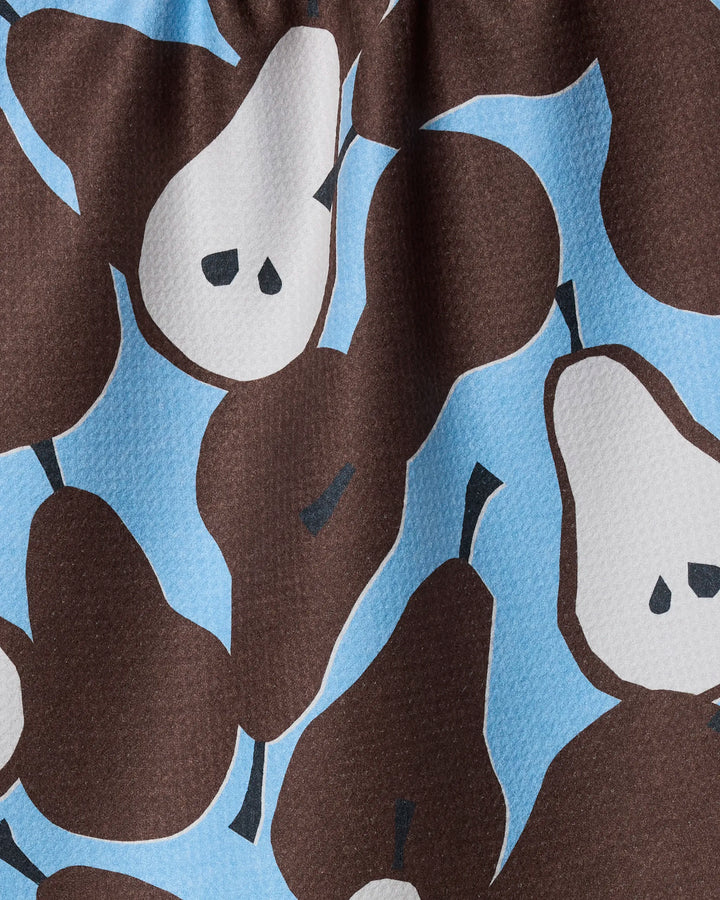 A close-up of the Graphic Pears dish towel by Claire Iglesias, showing stylized brown and white pears outlined in dark brown on a light blue background with simple, minimal details.