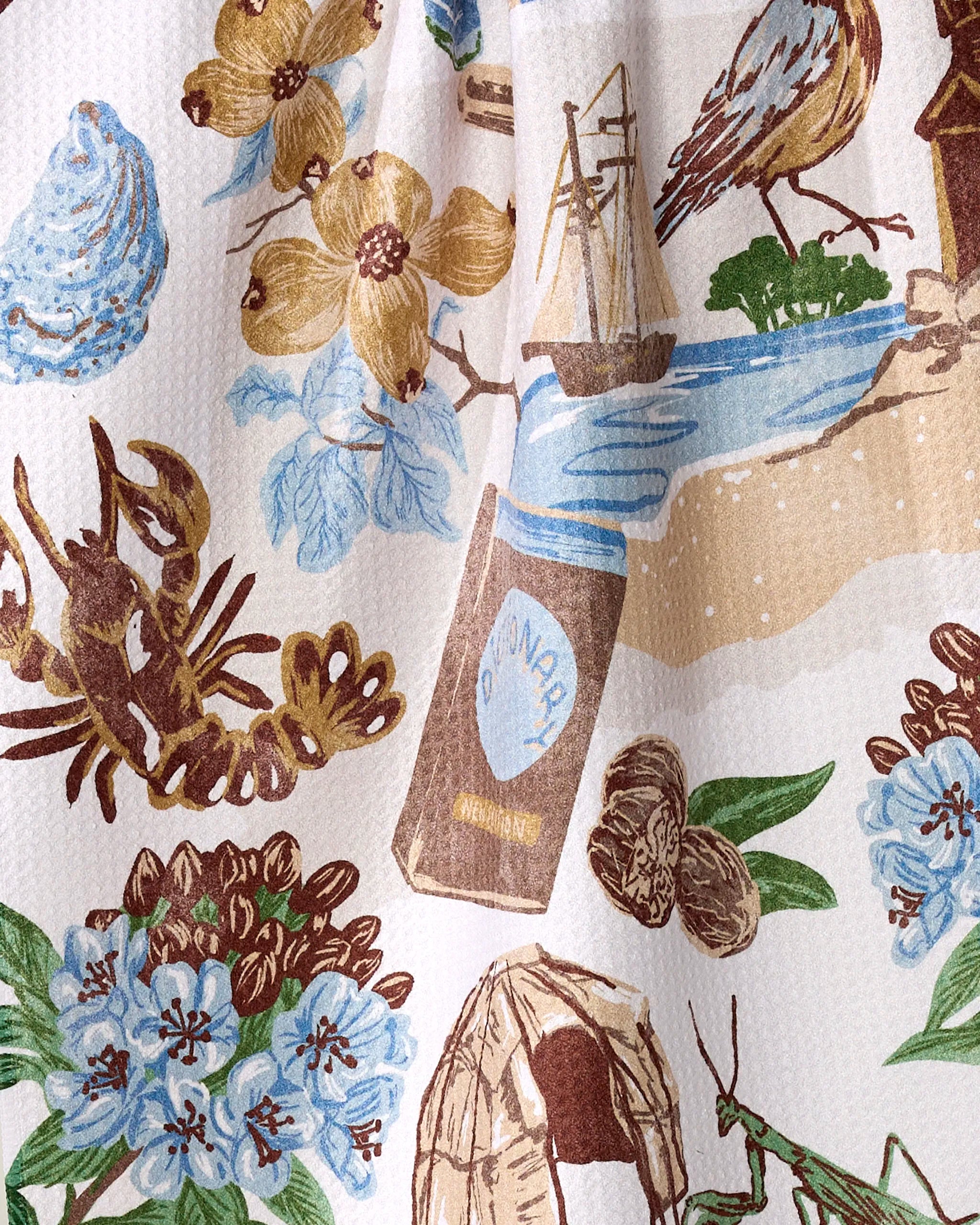The Greetings From Connecticut tea towel by Geometry showcases pastel illustrations—like a brown lobster, blue flowers, and a soda bottle—on white textured fabric. Made from recycled materials, it’s stylish, ultra-absorbent, and eco-friendly.
