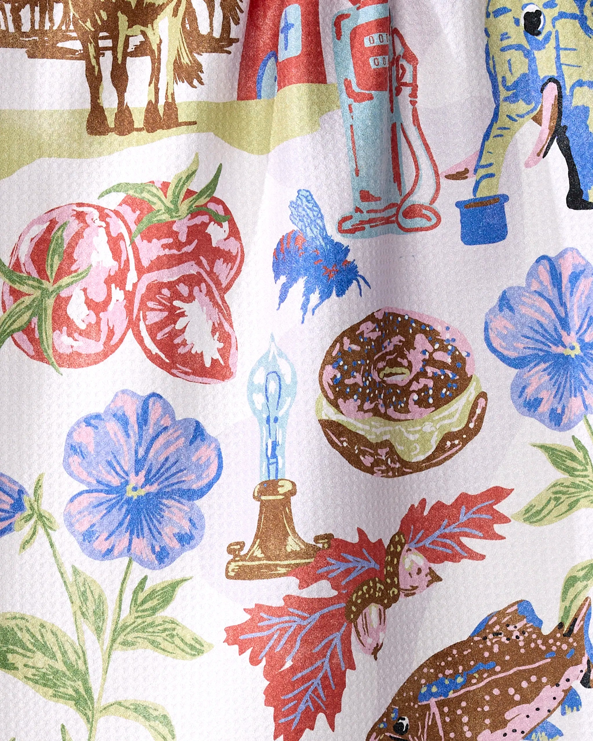 The "Greetings From New Jersey" tea towel by Geometry features vibrant illustrations on ultra-absorbent recycled materials, offering eco-friendly style.