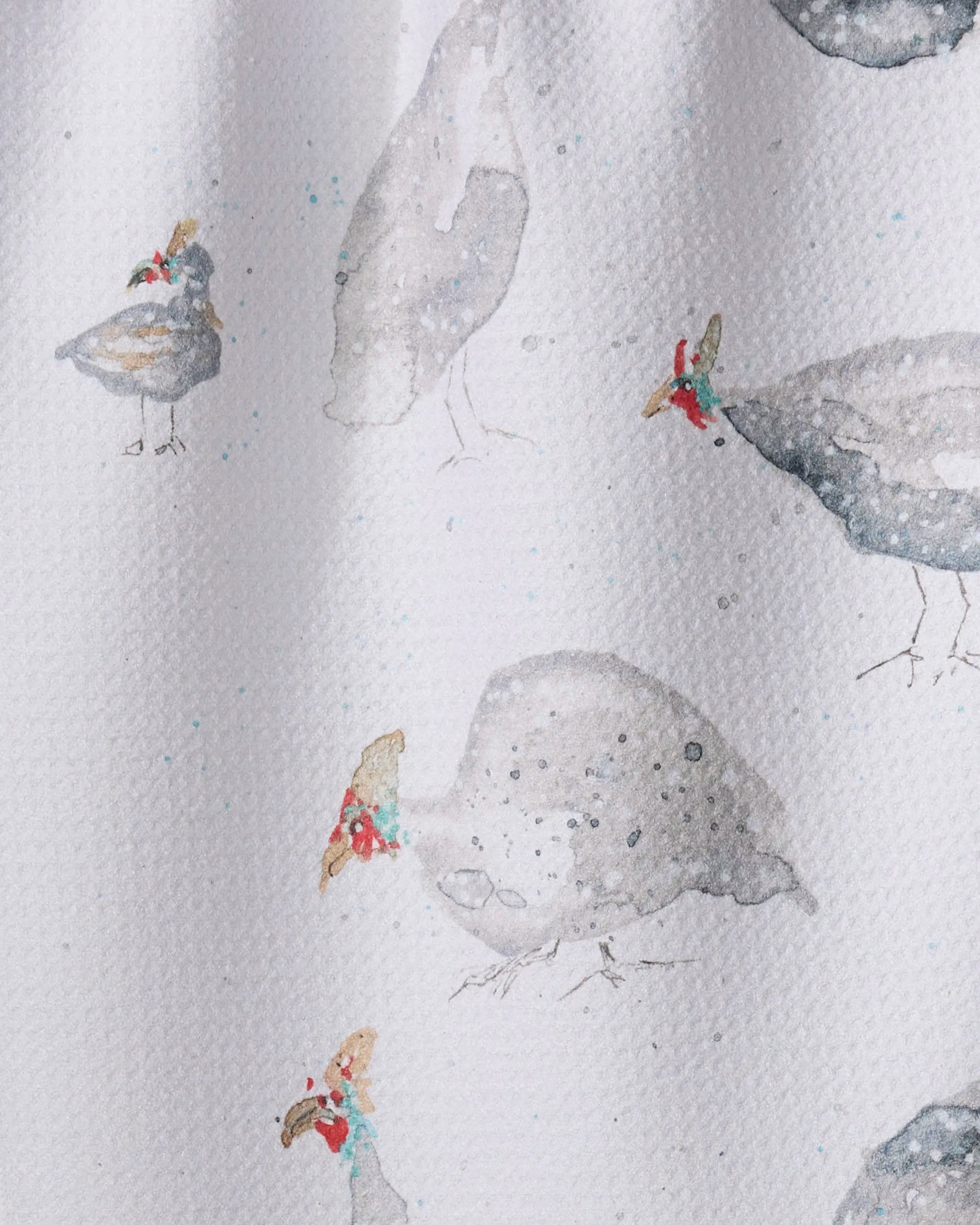 Guinea Fowls by Taryn Brennan features watercolor guinea fowls with red and blue heads on a textured white background, showing some standing and others pecking—ideal for tea towels made from recycled materials.