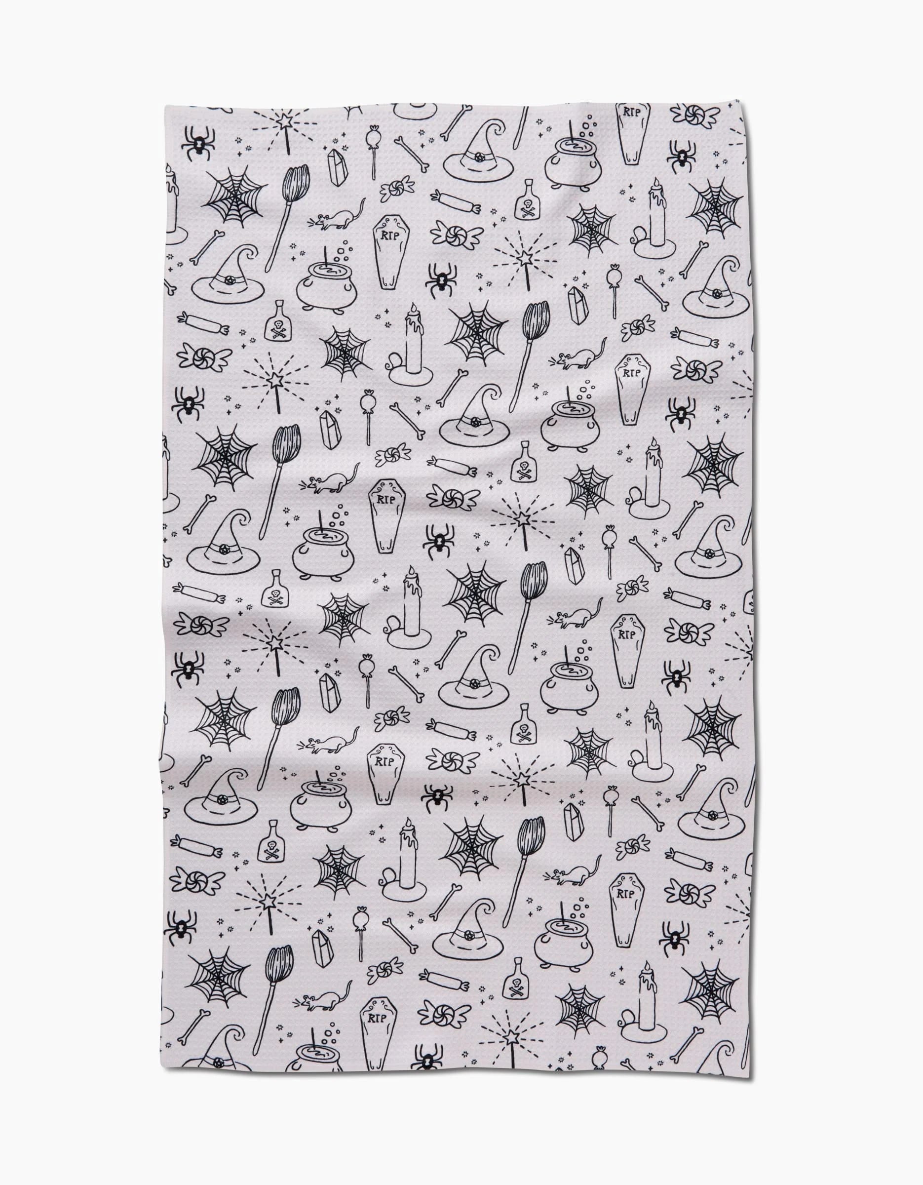 Kayla Ann’s Halloween Magic White features ultra-absorbent Geoweave fabric with a black line art pattern of spiders, webs, brooms, potion bottles, and whimsical Halloween icons arranged evenly for a festive seasonal accent.