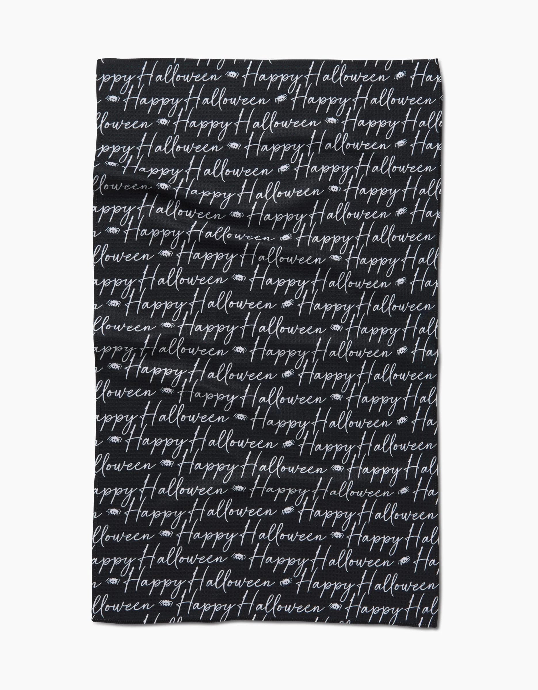 The Geometry Halloween Script Black tea towel showcases Happy Halloween in white cursive, repeatedly printed across its ultra-absorbent black surface for a festive look.
