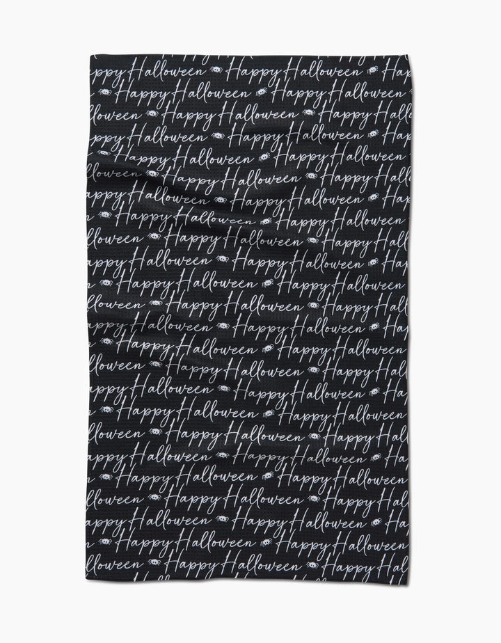 The Geometry Halloween Script Black tea towel showcases Happy Halloween in white cursive, repeatedly printed across its ultra-absorbent black surface for a festive look.