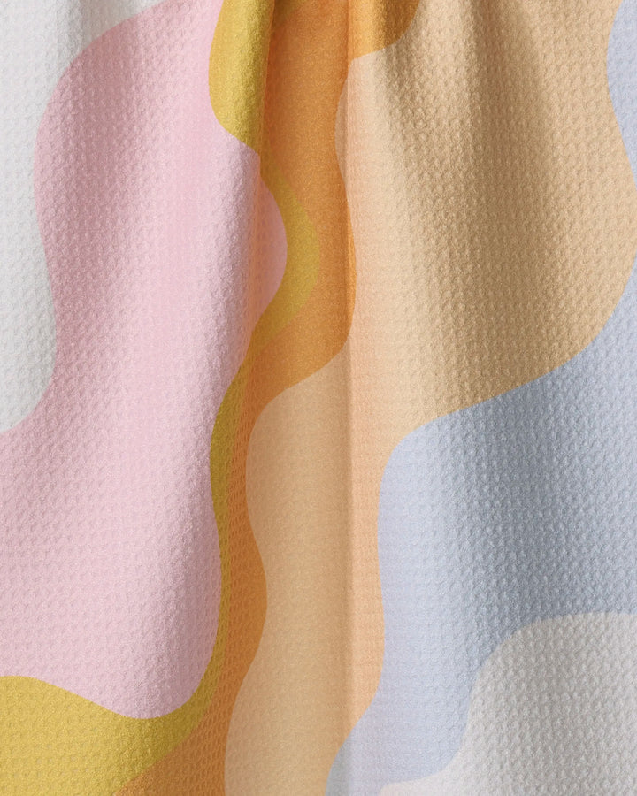 The Gerdadzy Happy Waves dish towel features a textured, absorbent surface and wavy abstract stripes in pastel pink, yellow, orange, beige, and light blue—an eye-catching design to brighten up your kitchen.