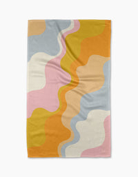 The Gerdadzy Happy Waves tea towel features an abstract wavy pattern in pastel on white. Made from quick-drying recycled materials, its playful modern design showcases overlapping curves for a cheerful kitchen accent.