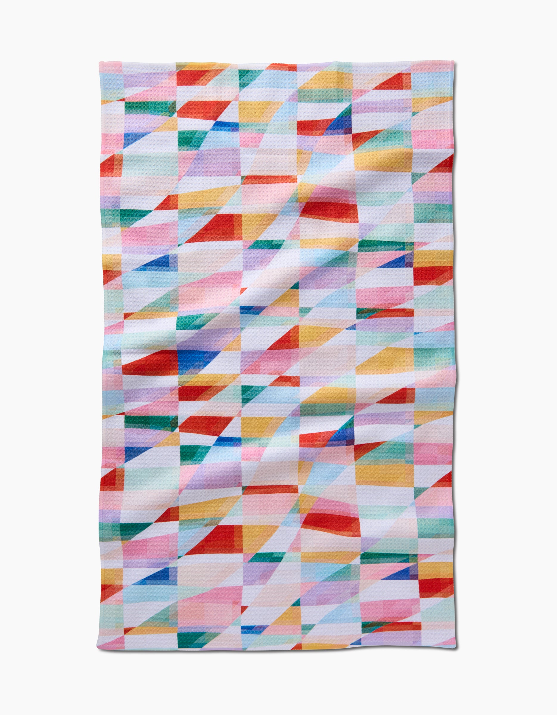The Highlands tea towel by RACHEL PARKER features a vibrant geometric pattern of overlapping red, blue, yellow, pink, and green triangles and squares on white Geoweave fabric.