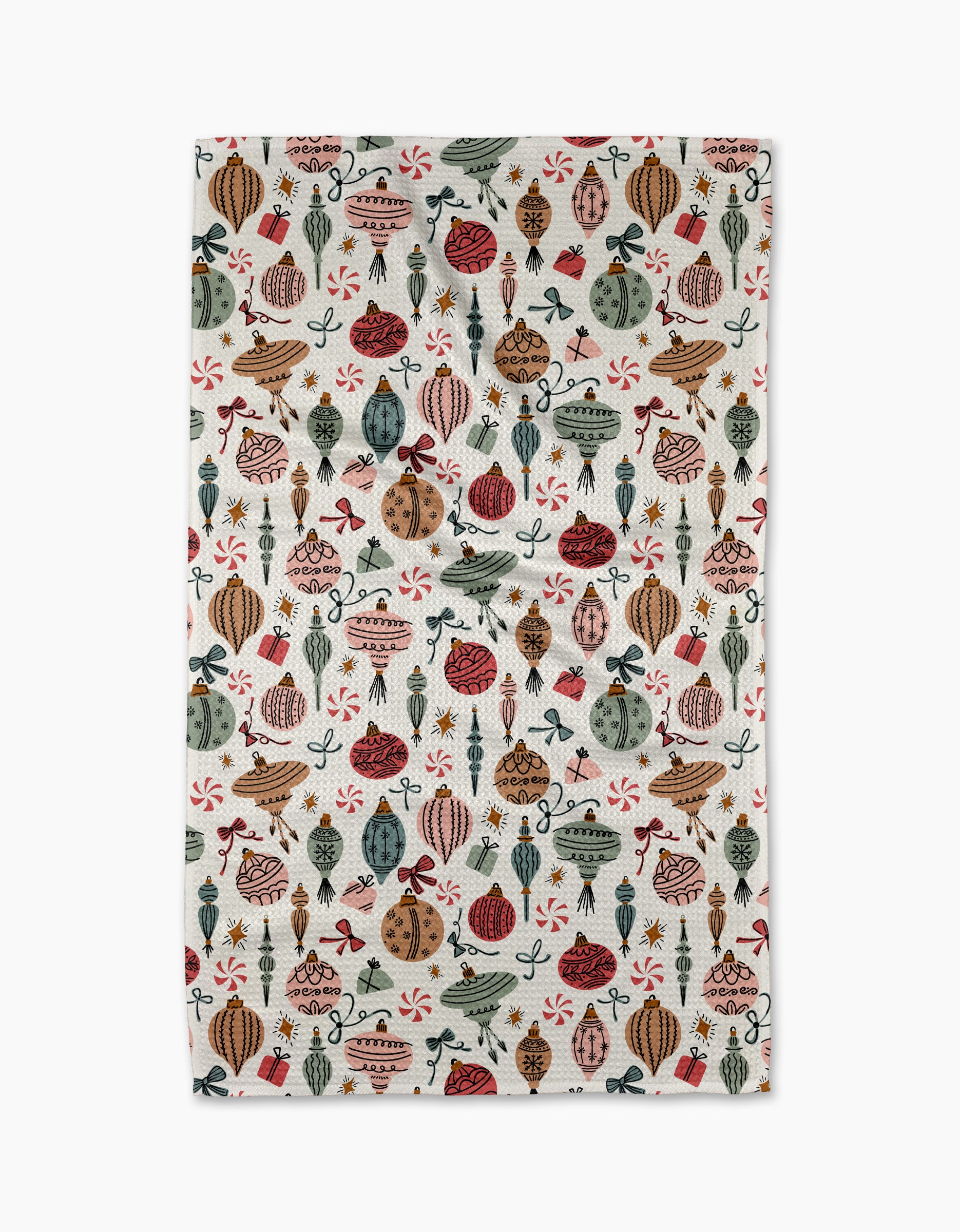 The Holiday Ornaments kitchen towel by Charlie Rowan Designs is crafted from recycled materials and features a festive vintage ornament pattern in red, green, gold, and brown with bow and star accents.