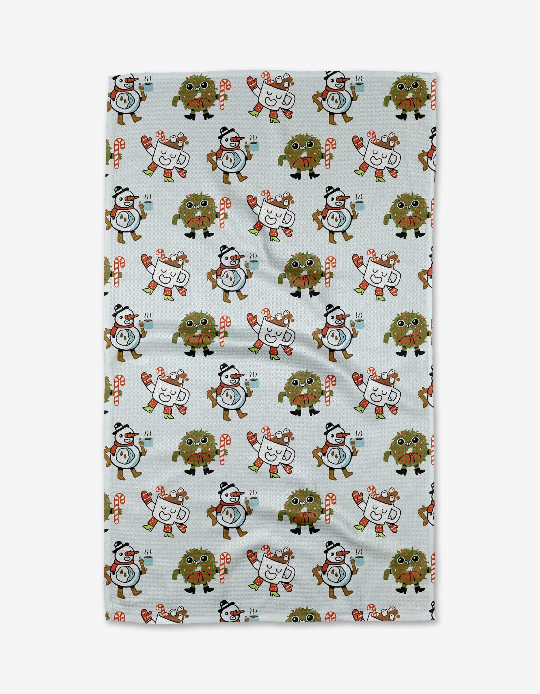 The Carly Berry Holiday Pals dish towel features cartoon penguins, reindeer, brown bears, candy canes, and snowflakes in winter accessories on a light background—adding cheerful holiday style to your kitchen.