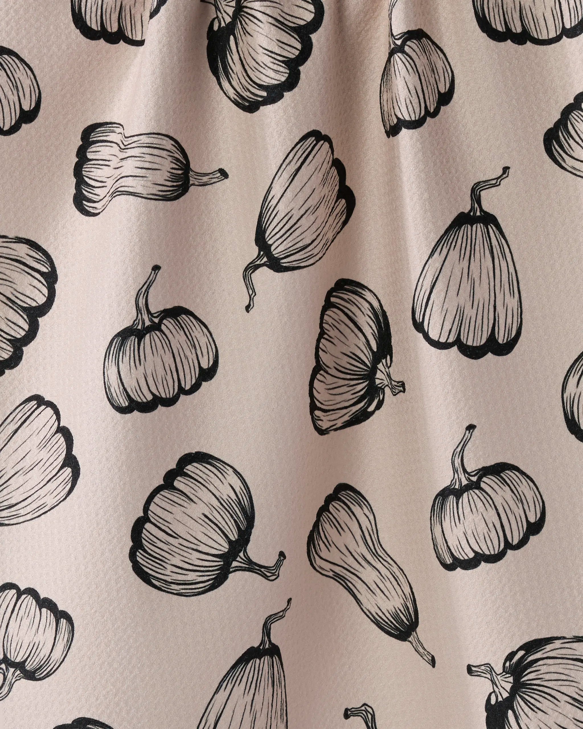 Hollow Season by Geometry: a cream-colored recycled kitchen towel with a hand-drawn black outline pattern of gourds and pumpkins in various shapes, adding textured style to your kitchen.