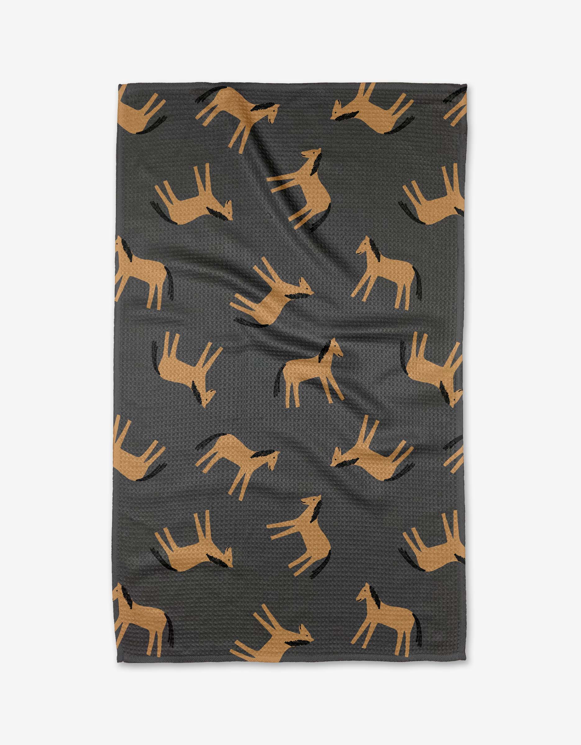 The Coit Creative Horses blanket is dark gray, made from recycled materials, and showcases a repeating pattern of stylized brown horses in various directions.