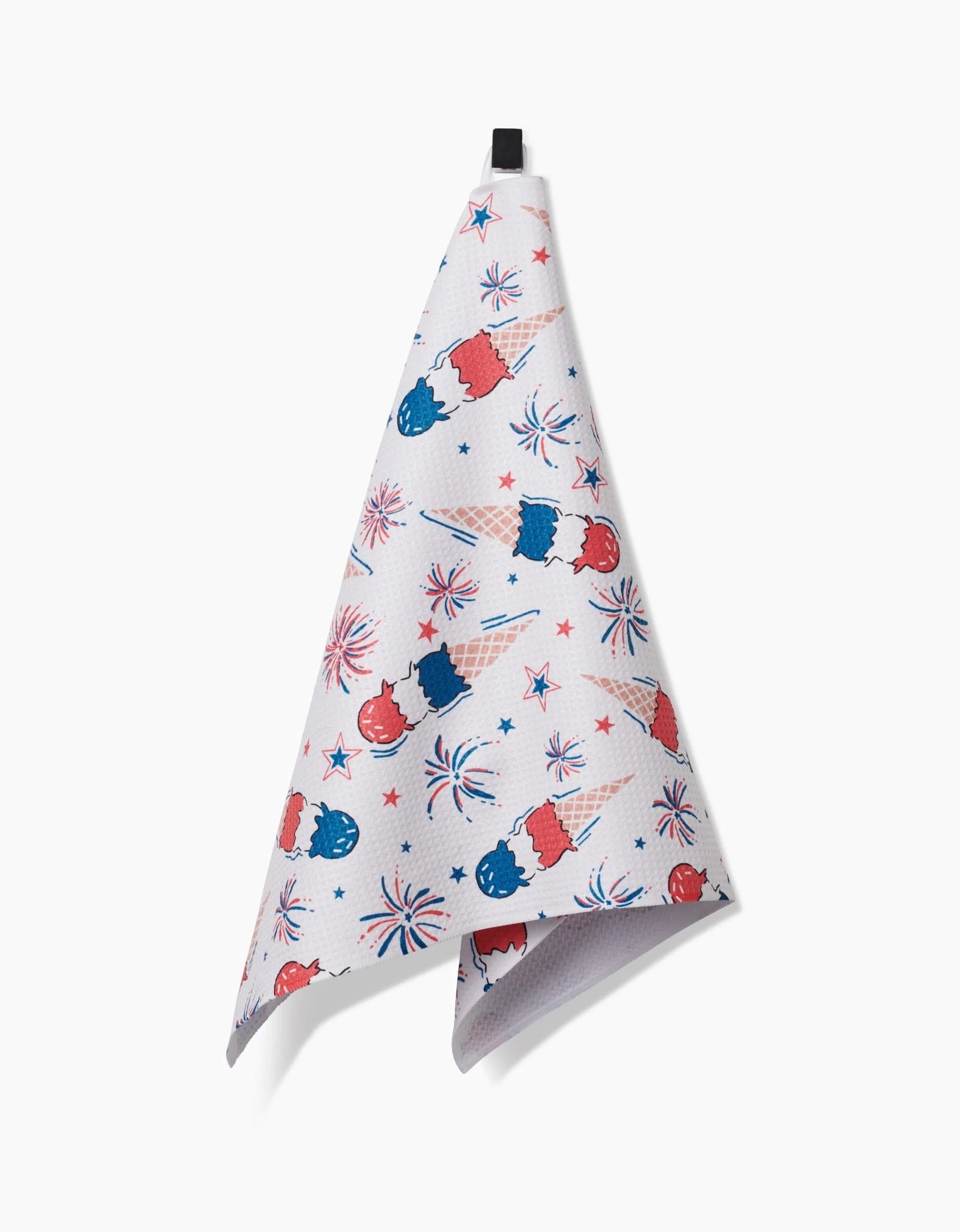 The Ice Cream Celebration tea towel by Hufton Studio features a festive design with red, white, and blue ice cream cones, fireworks, and stars. Made from recycled materials for absorbency and eco-friendliness; includes a hanging loop.