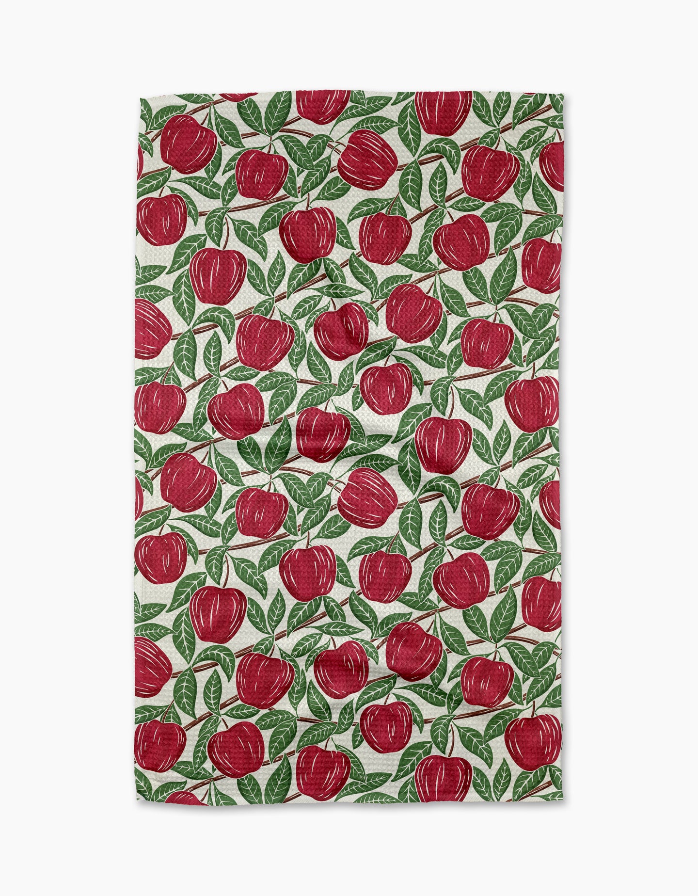 The In the Apple Tree towel by Sarah Daugherty is a rectangular, quick-drying towel with a white background and a repeated red apple with green leaves pattern.