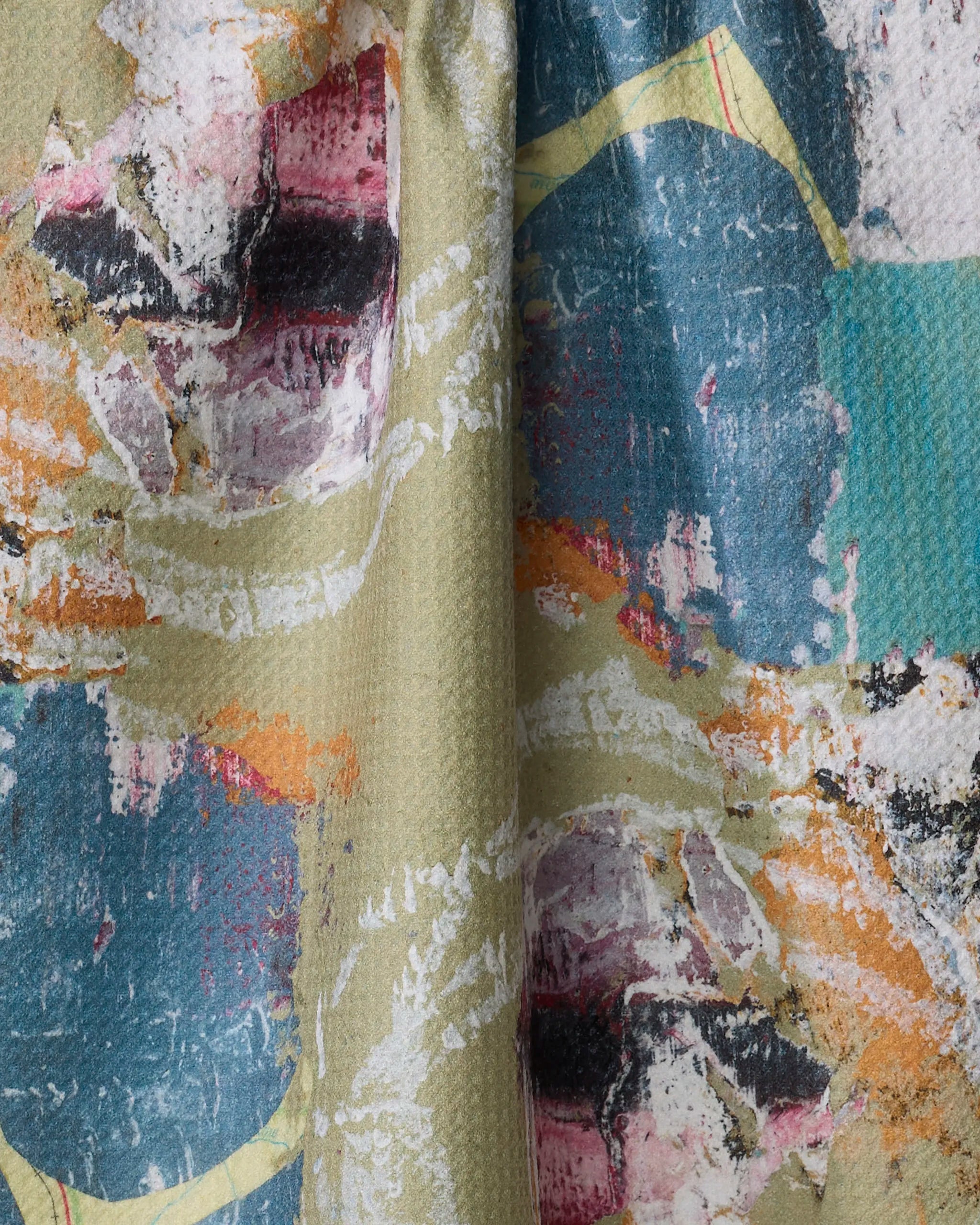 The "It's All In a Day's Work" dish towel by Katherine Berkeley features an abstract, textured design with brush-like strokes in blue, pink, orange, white, and green—blending artistry and absorbency for your kitchen.