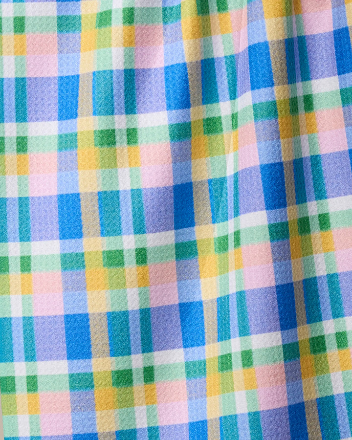 The Geometry Jelly Bean tea towel features a vibrant checkered design in blue, green, yellow, and pink. Made from recycled materials, it’s ultra-absorbent with a soft, slightly textured feel—perfect for brightening any kitchen.