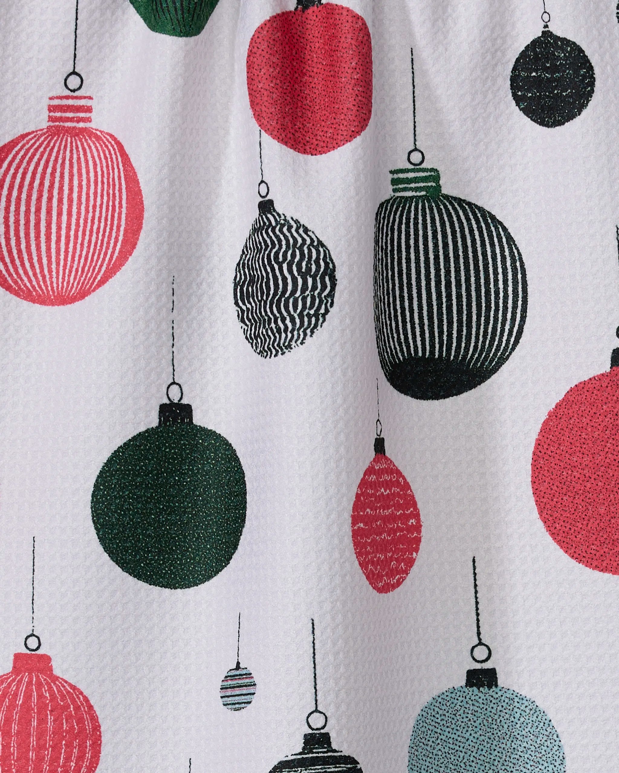 Jingles by Geometry is an ultra-absorbent towel showcasing red, green, and black Christmas ornaments with striped and dotted patterns on a white background—ideal for bringing holiday cheer to your kitchen.