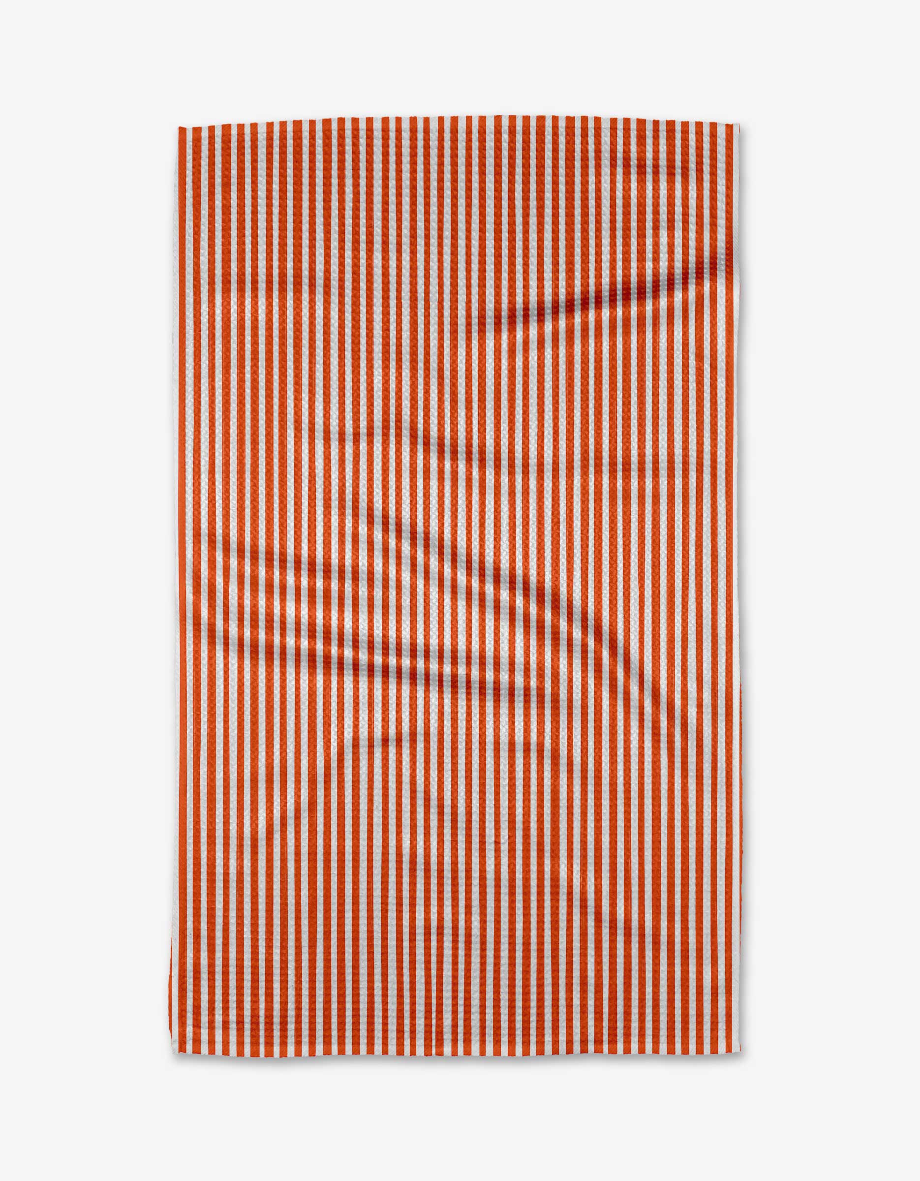The Kailee Wright Jolly kitchen towel, a rectangular piece made from recycled materials with vertical orange and white stripes, is shown laid flat on a white surface with subtle folds and creases.