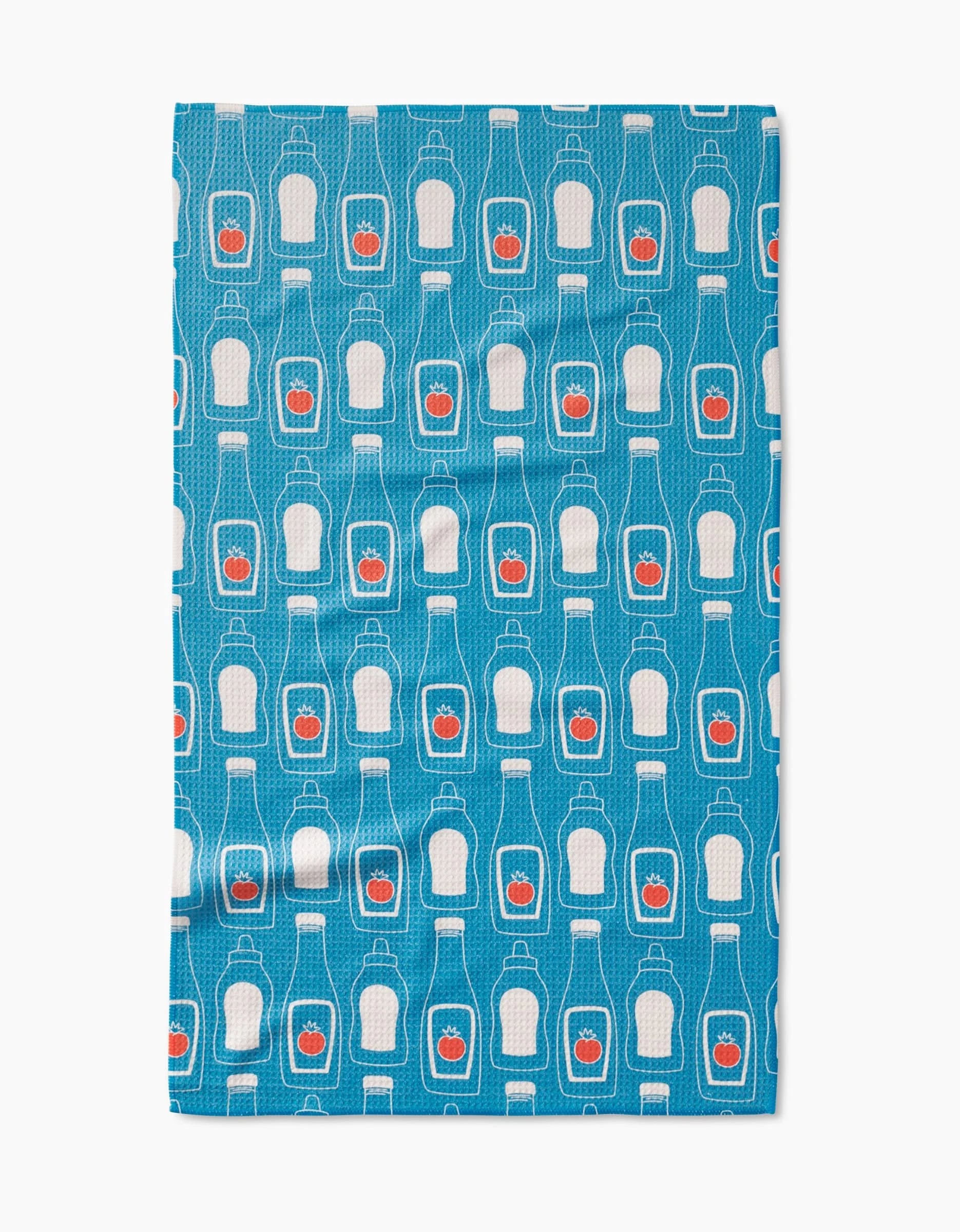 The July Squeeze by Sara Mari is a blue, ultra-absorbent Geoweave cloth featuring a repeating ketchup bottle pattern with red tomato labels.