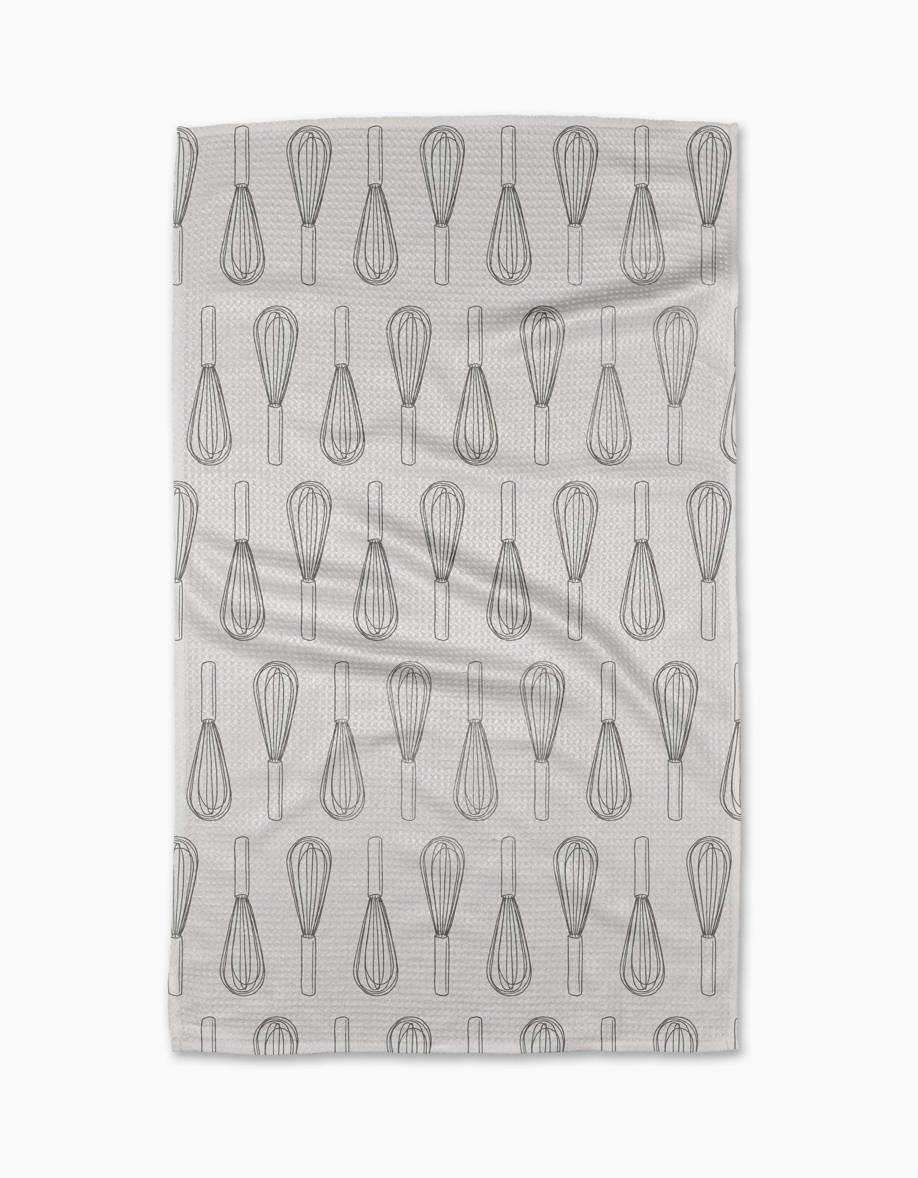 The Rosa Kichline Kitchen Whisks tea towel features a repeating pattern of black whisk line drawings on white, arranged in neat rows. Made from recycled materials, it has a subtle texture and is displayed on a plain white background.