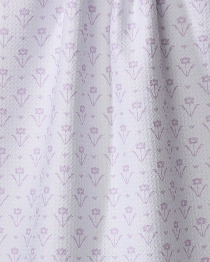 Ladylike Too - Lilac by The Buy Guide features light purple recycled tea towel fabric with a subtle floral pattern and a gently textured surface, draped to create soft folds and shadows.