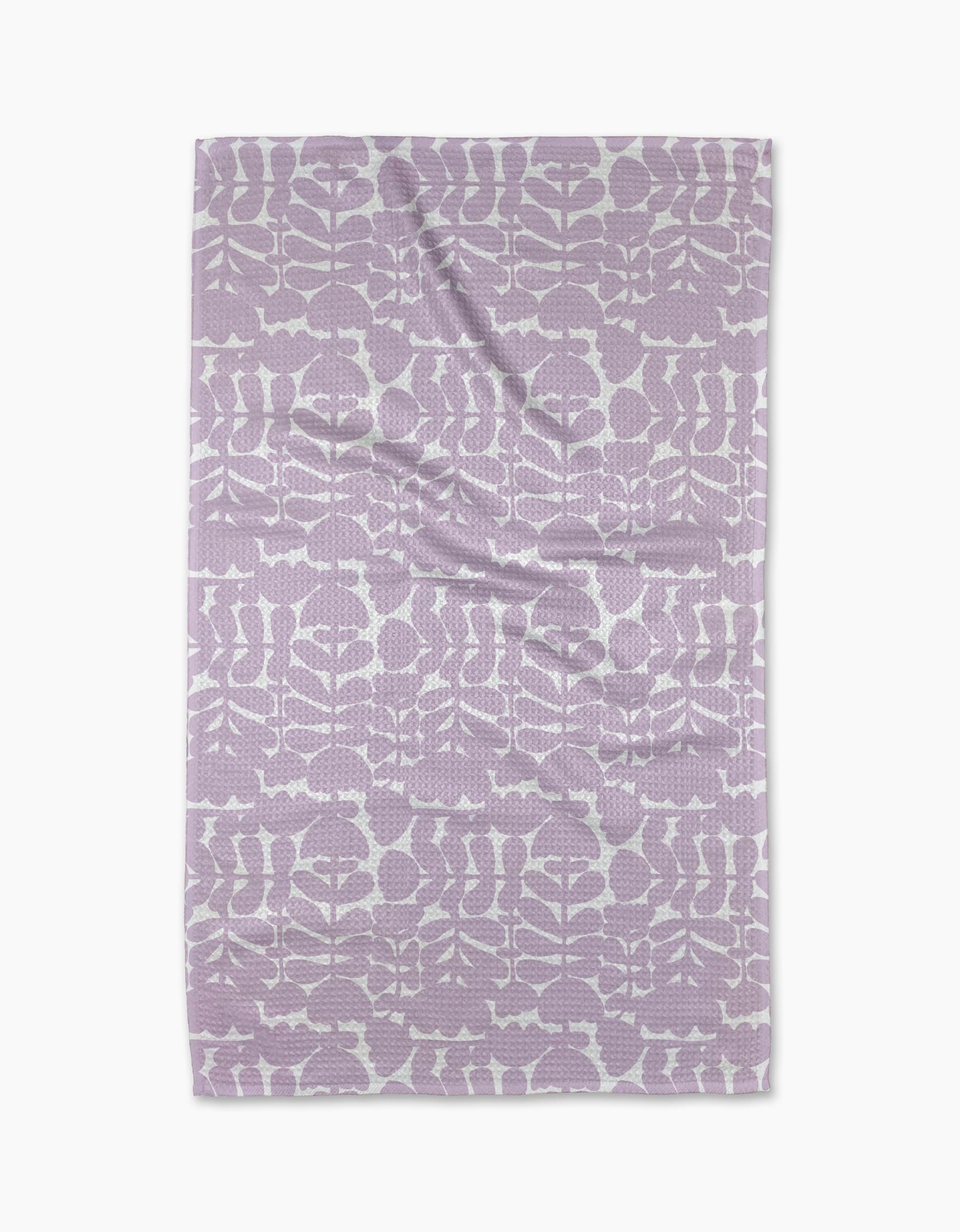 The Lavender Scandi Flowers blanket by Katie OShea, made from recycled materials, showcases a lavender and white floral pattern arranged in rows, displayed flat against a white background.