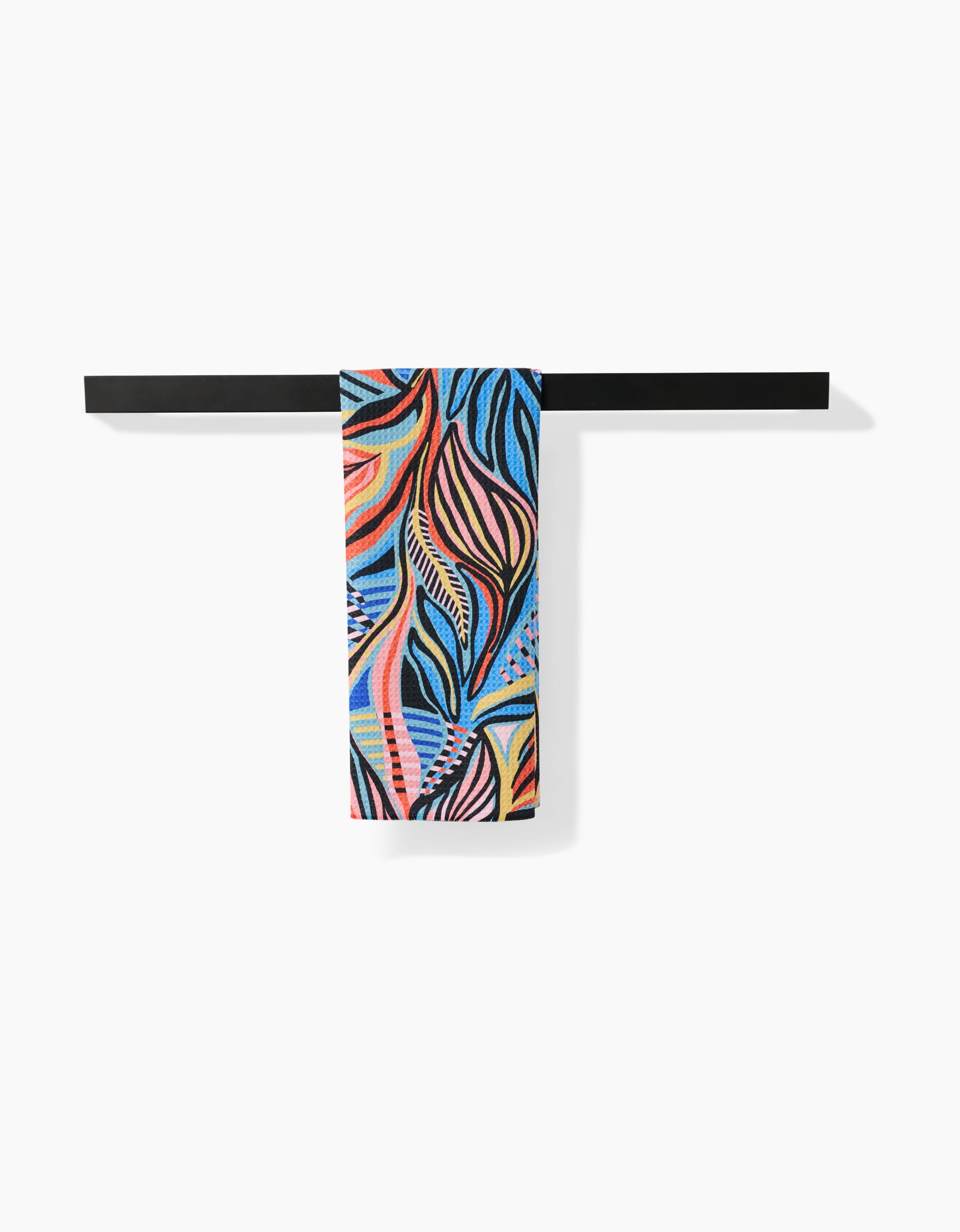 The Leafy Path tea towel by Masha Volnova features an abstract, wavy design in blue, orange, pink, black, and yellow on Geoweave fabric and hangs on a black rack against a white background.
