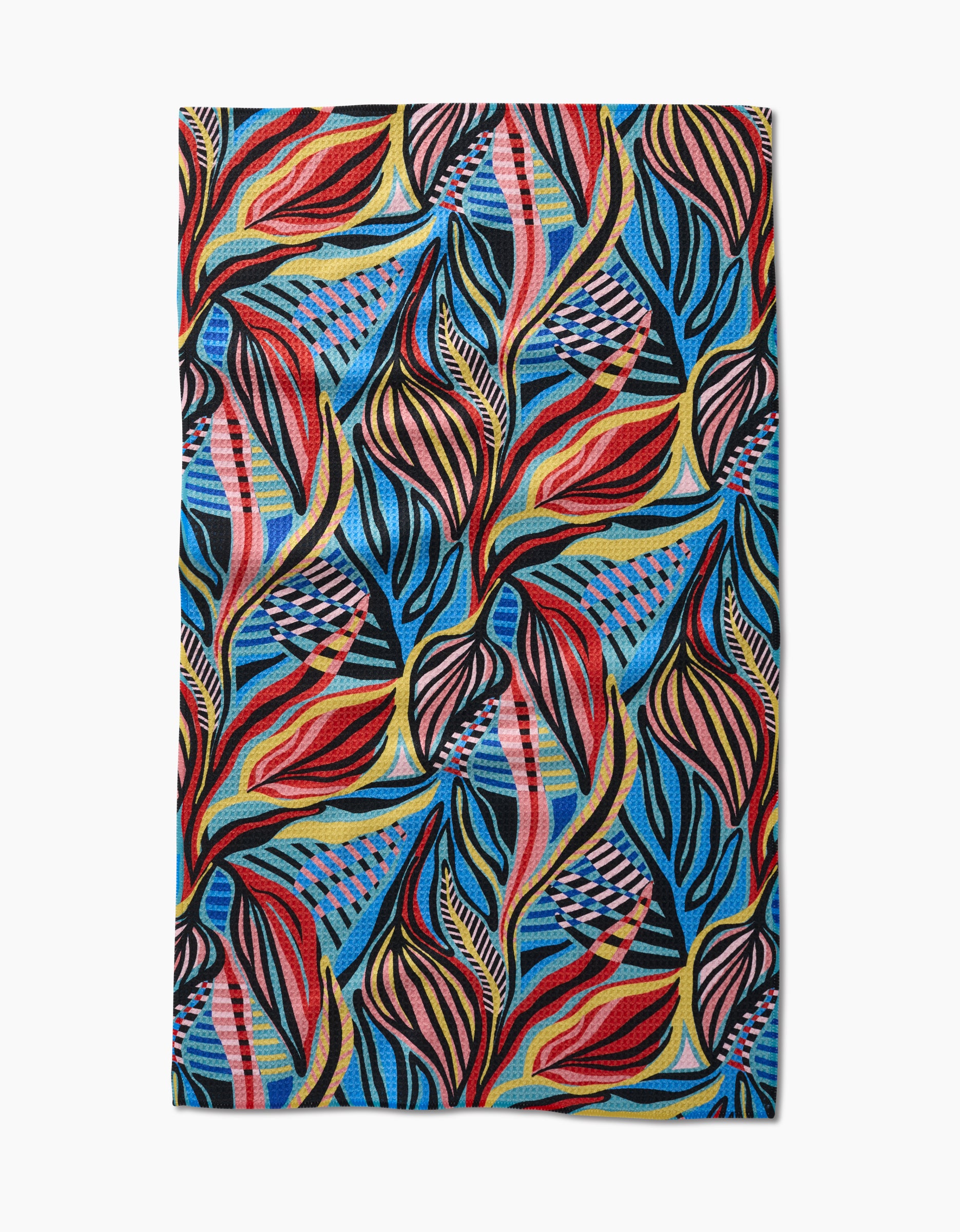 The Leafy Path Tea Towel by Masha Volnova features swirling, leaf-like shapes in red, yellow, blue, and black with striped and checkered accents on a vibrant Geoweave blue background.