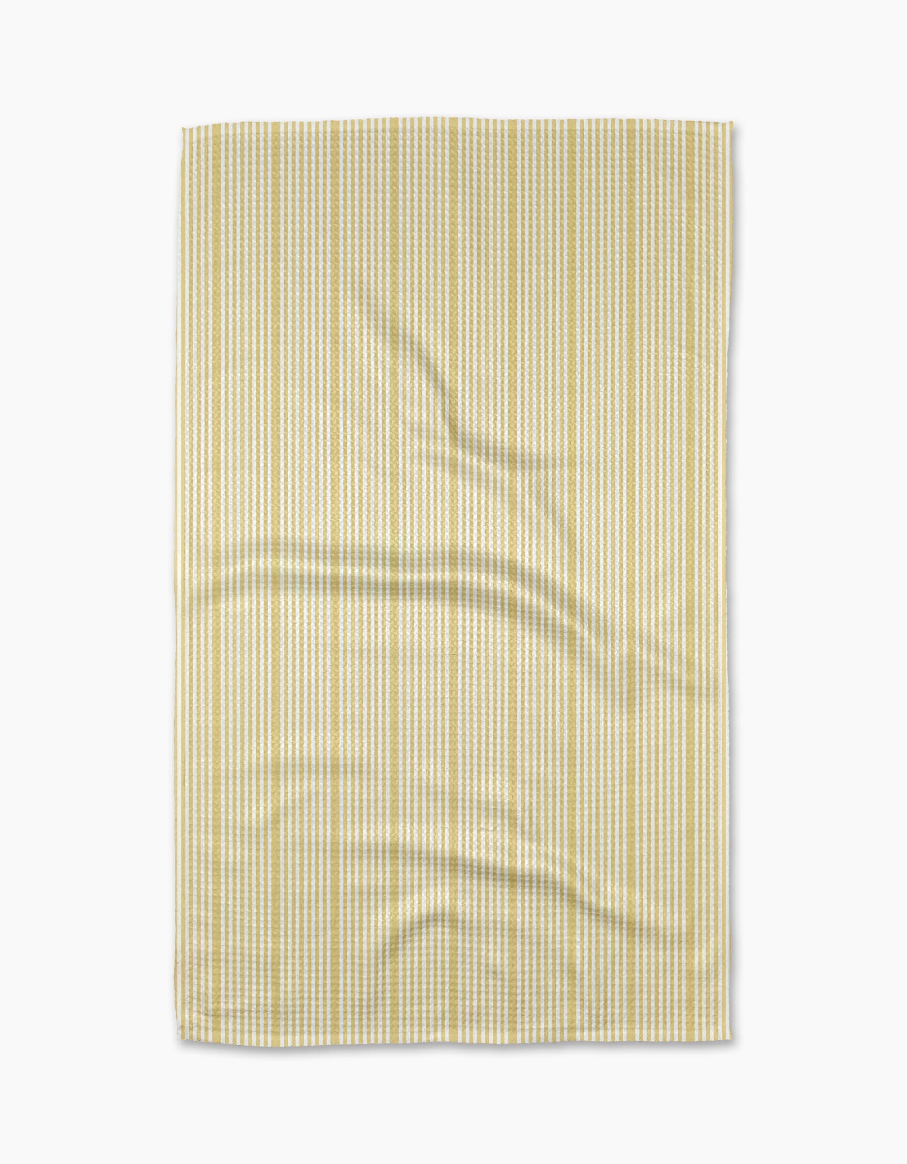 The Geometry Lemon Ice Geoweave fabric features light yellow and white vertical stripes, displayed flat with minor wrinkles on its ultra-absorbent surface, set against a white background.