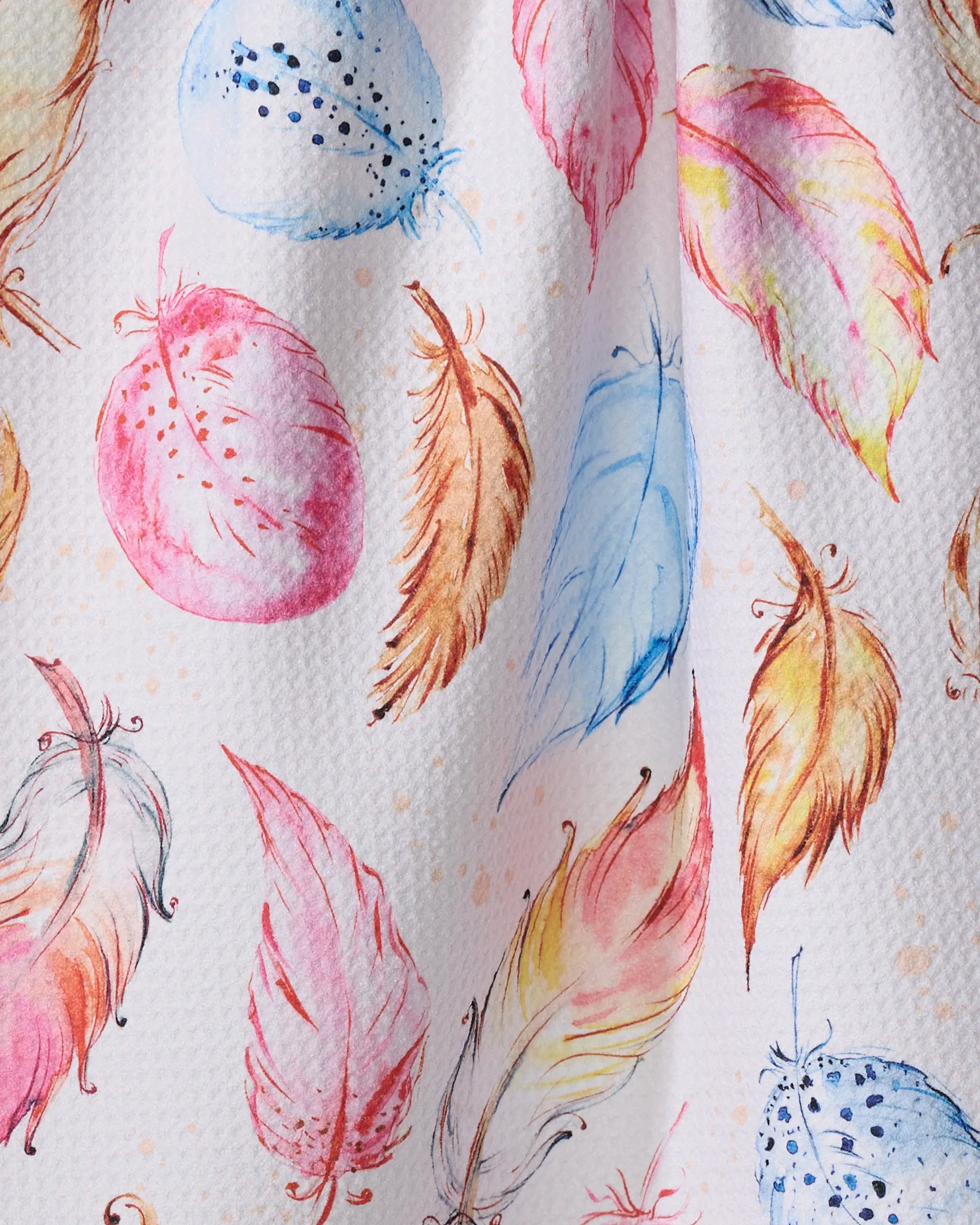 “Light as a Feather” by Elena Fay features vibrant watercolor feathers and round seed pods in pink, blue, yellow, and orange on textured white—creating a whimsical pattern ideal for an ultra-absorbent or recycled kitchen towel.