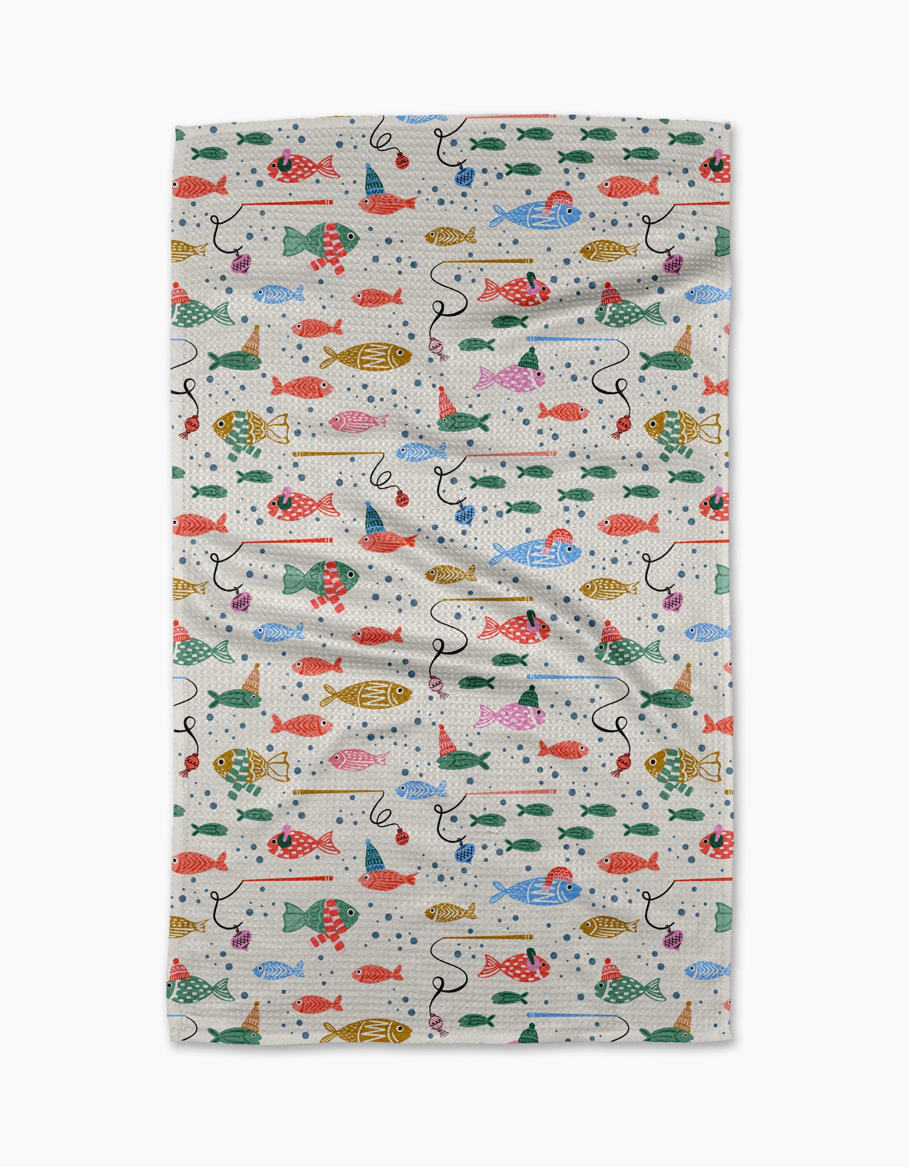 The Light Holiday Fish tea towel by Charlie Rowan Designs is a rectangular white towel with a colorful fish, bait, and hook pattern. Made from recycled materials, it has some wrinkles and is shown on a plain white background.