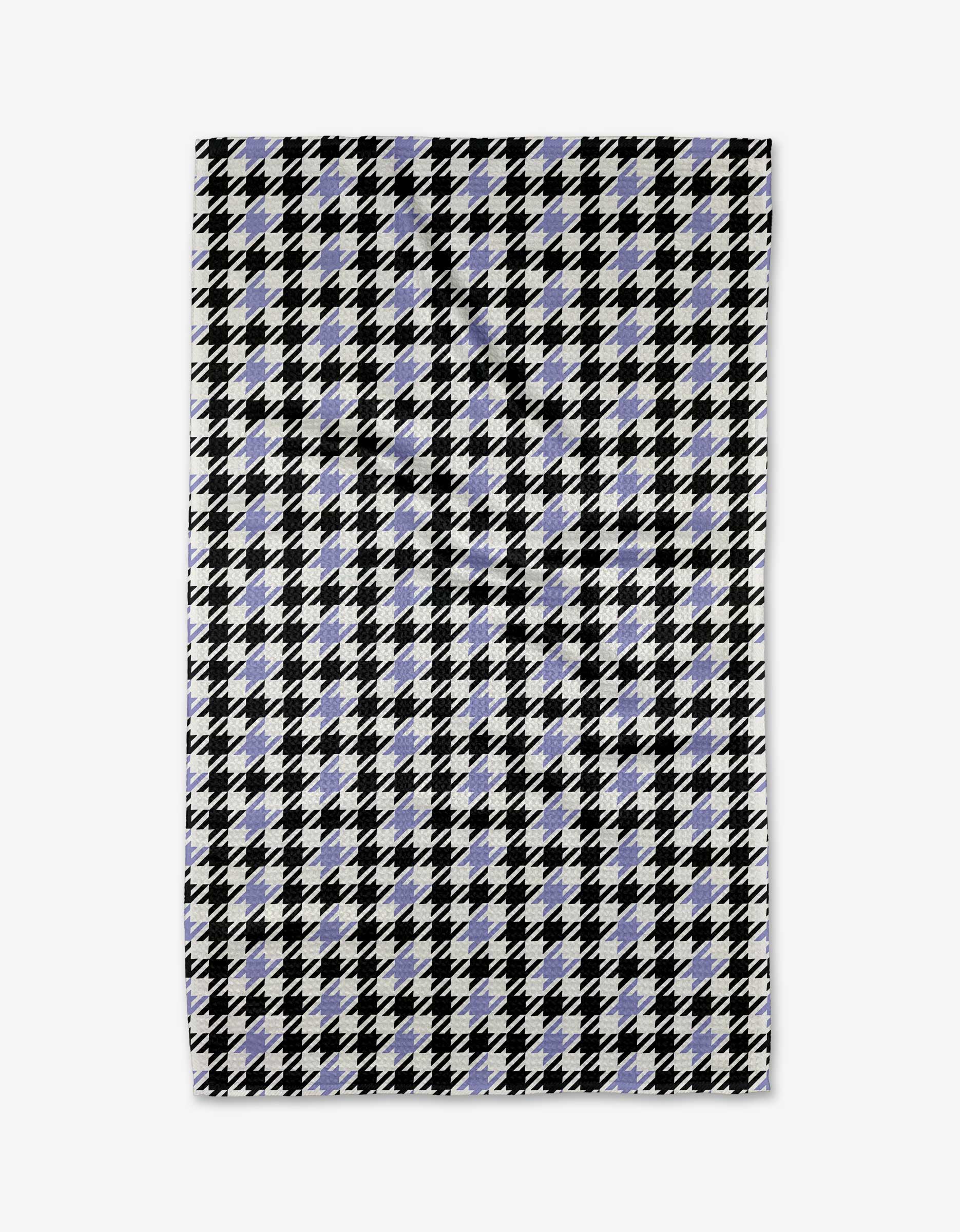 The Lilac Houndstooth tea towel by Hufton Studio features a black and white houndstooth pattern with light blue accents. Ultra-absorbent, it offers both style and practicality for any kitchen. Shown laid flat on a white background.