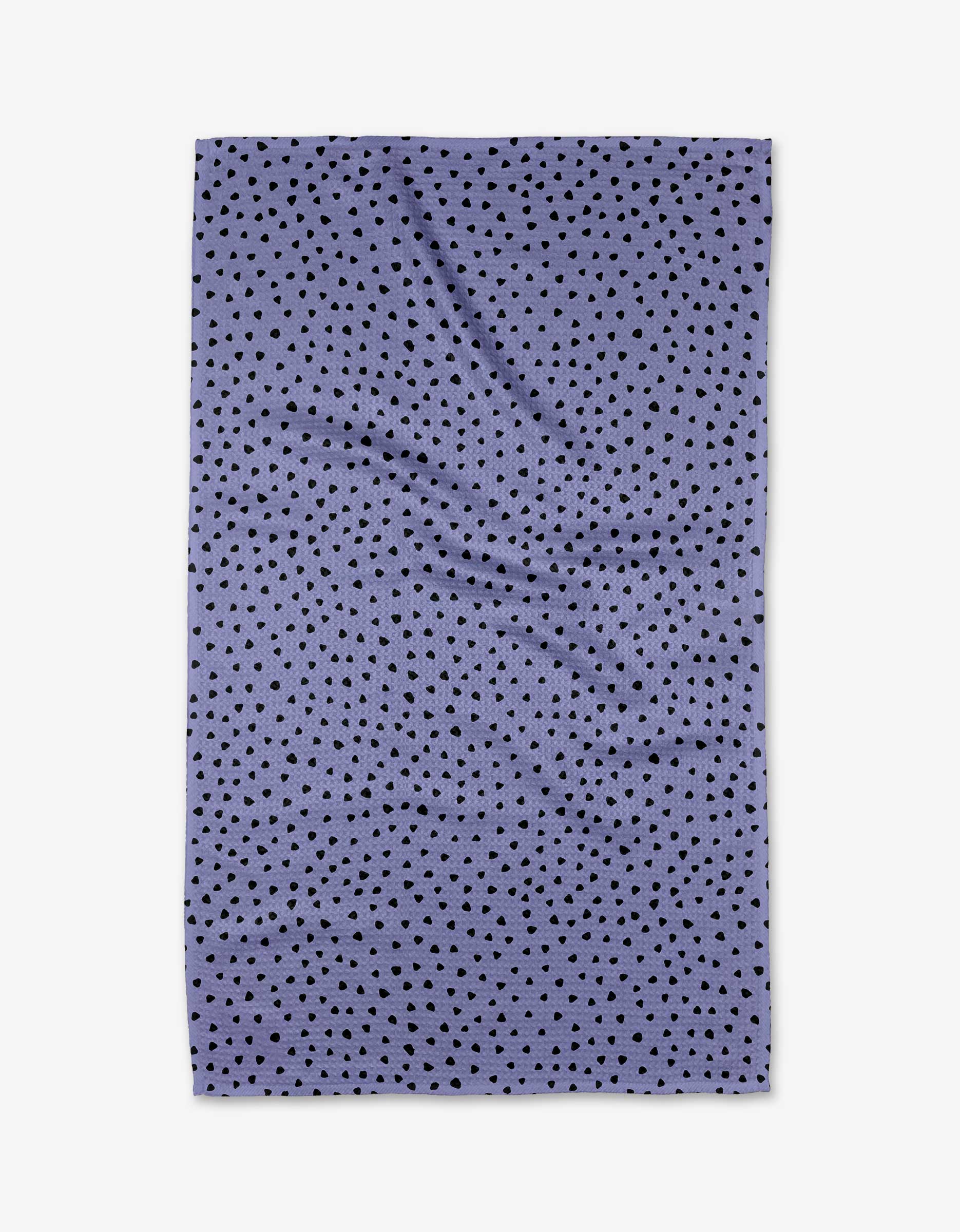 The Hufton Studio Lilac Speckle kitchen towel features a rectangular lavender design with evenly scattered small black dots, shown on a white background.