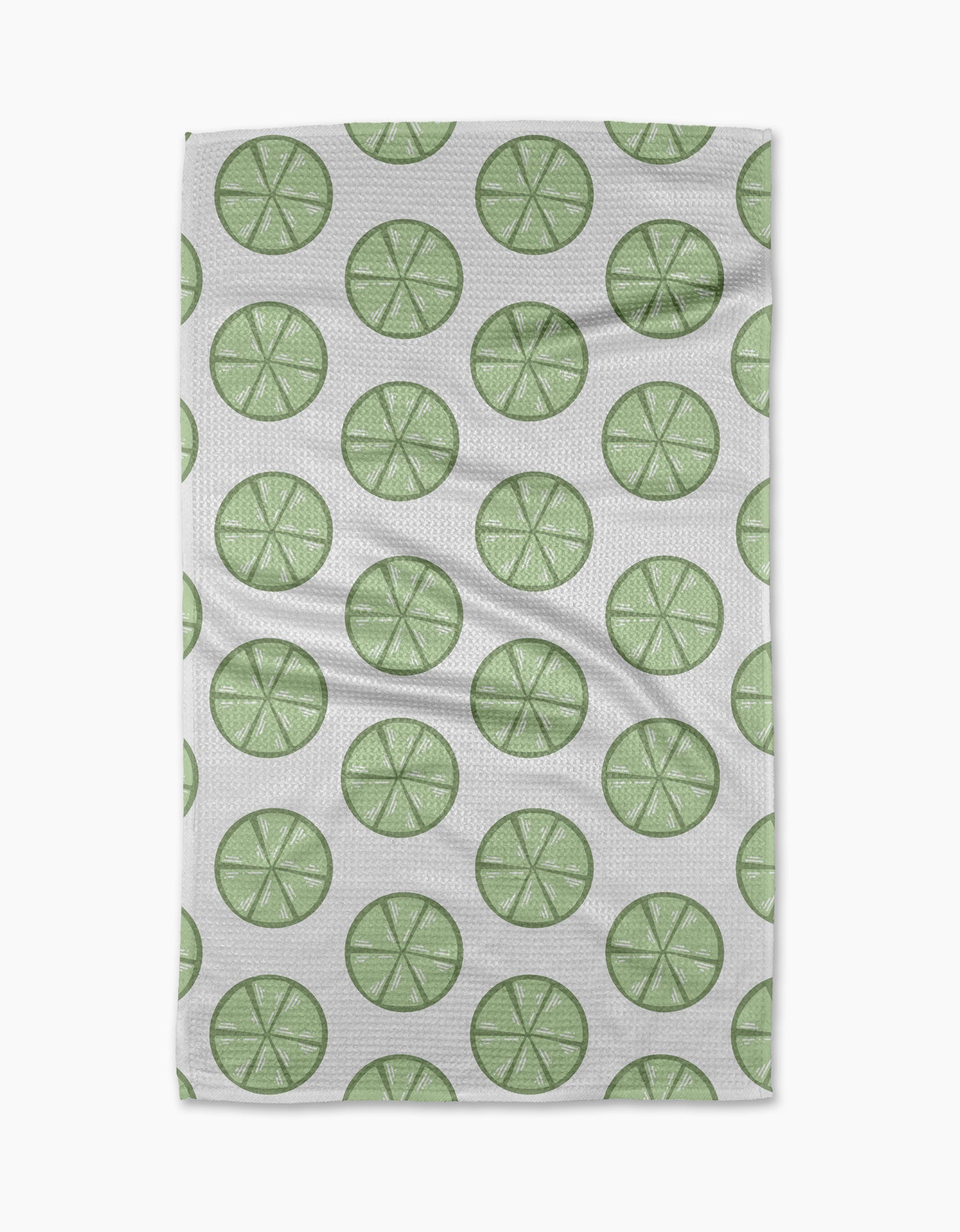 Lime Doodles by Letters By Shells is a quick-drying tea towel with a repeating pattern of green lime slices, each with visible segments, arranged in neat, evenly spaced rows.