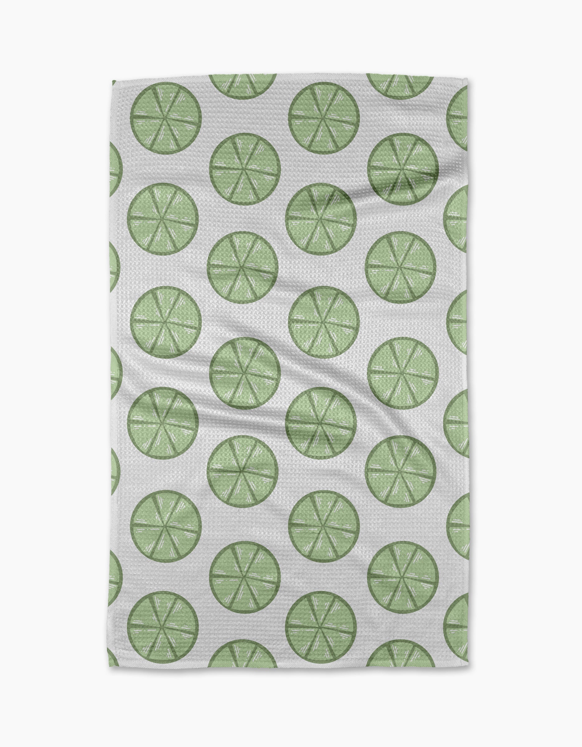 Lime Doodles by Letters By Shells is a quick-drying tea towel with a repeating pattern of green lime slices, each with visible segments, arranged in neat, evenly spaced rows.