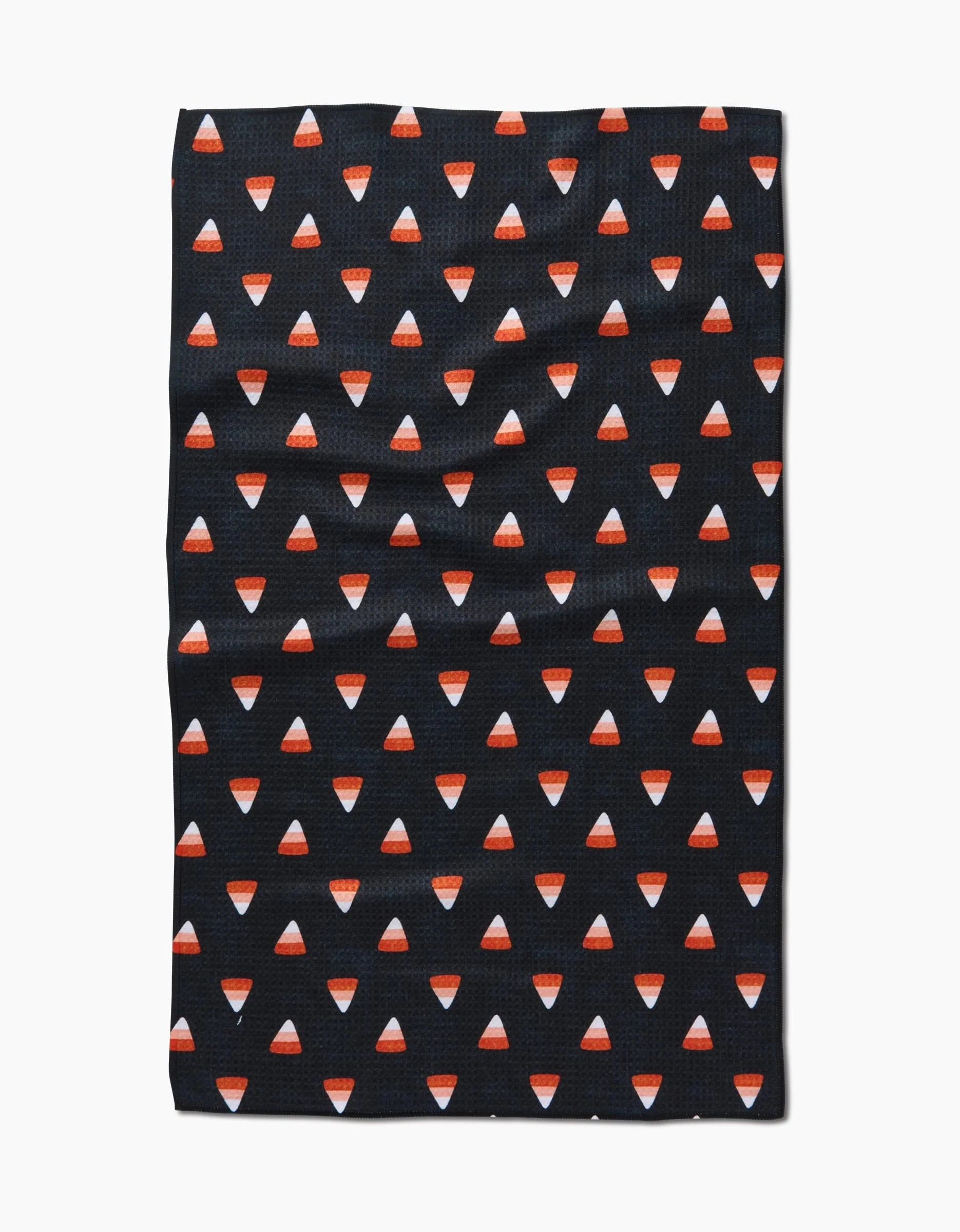 The Linnet by Amy MacCready is a black kitchen tea towel crafted from recycled materials, featuring an all-over print of small candy corn pieces.