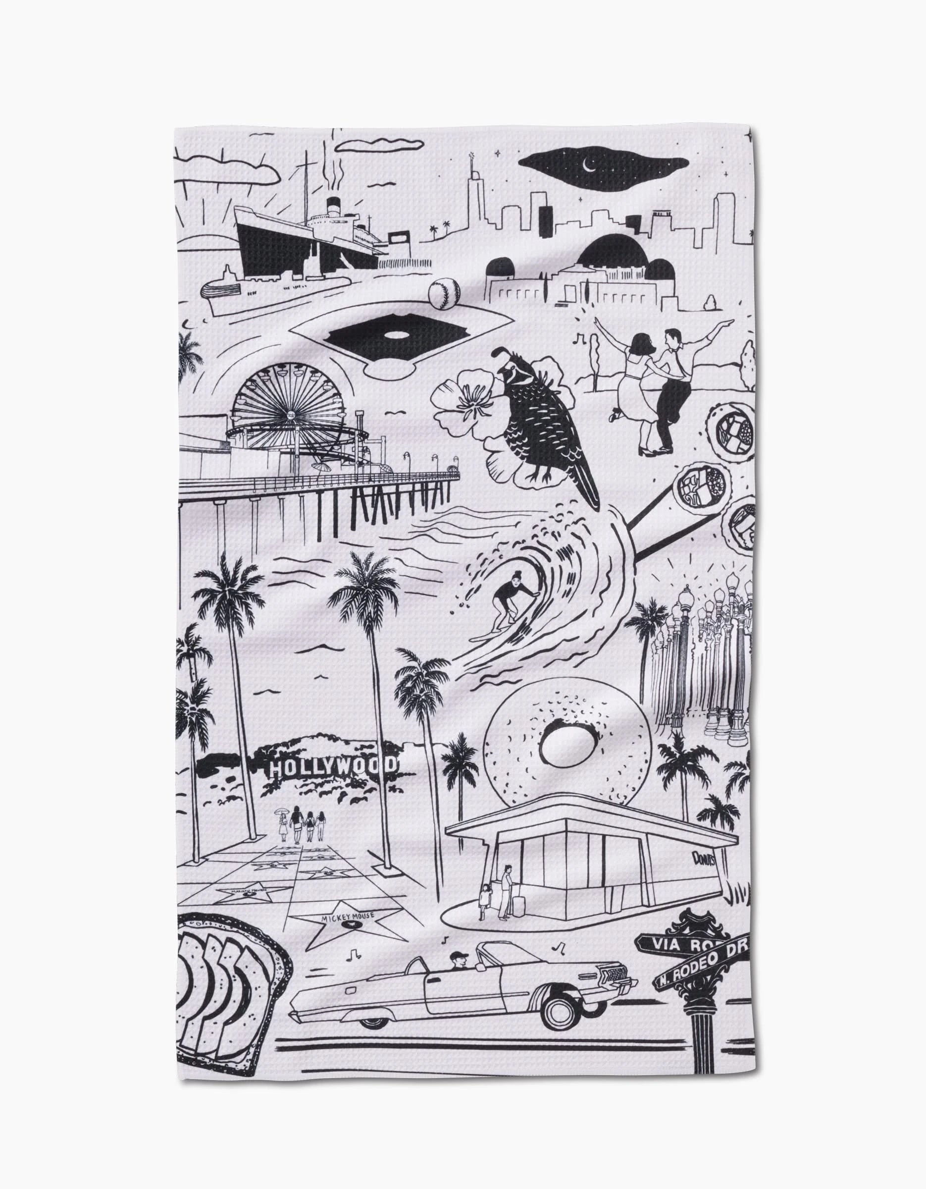 Los Angeles Tea Towel by Elisabeth Wing showcases black and white illustrations of city landmarks on soft Geoweave™ fabric made from recycled materials.