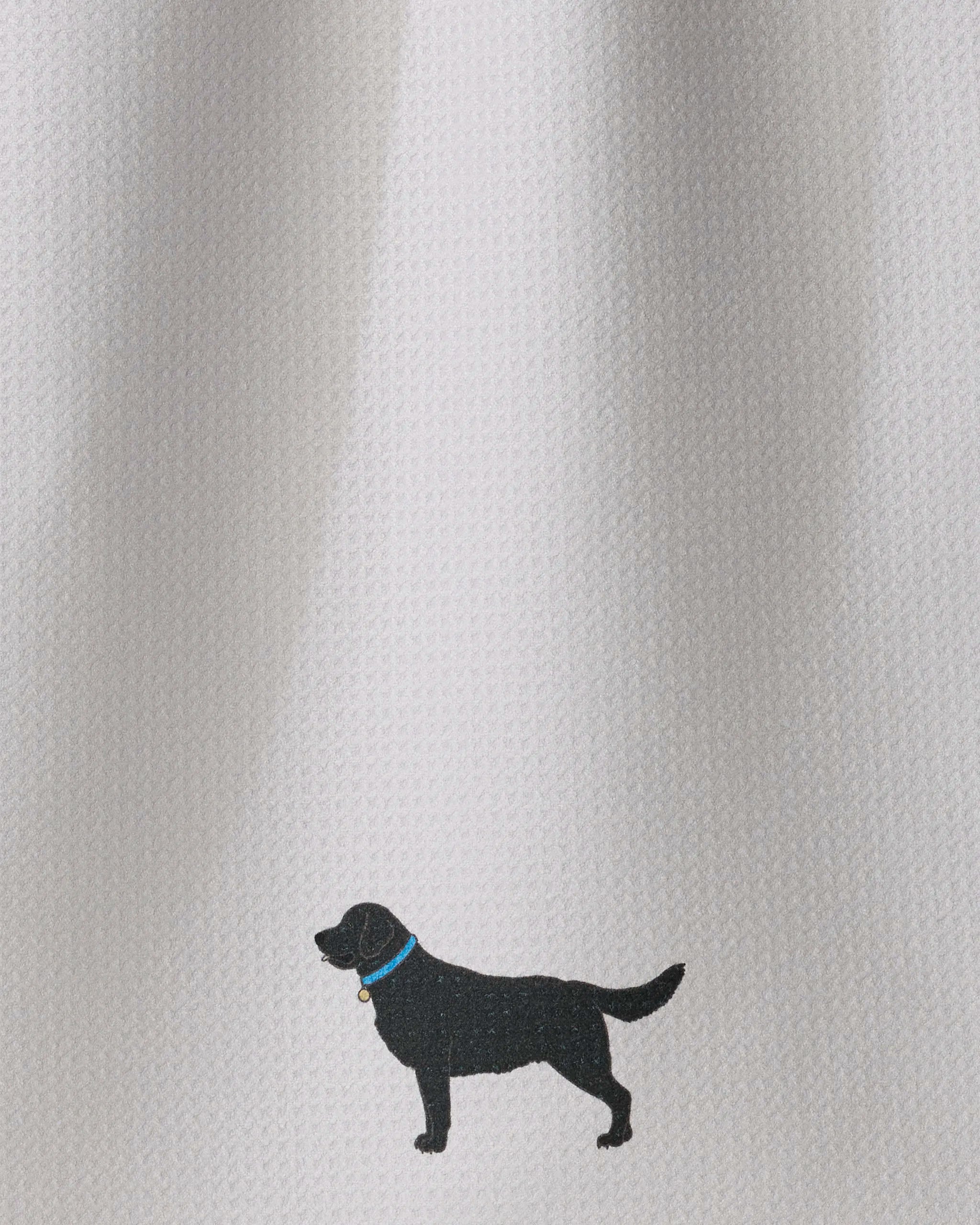 The “Loyal Lab” tea towel by Geometry features a stylish small black dog silhouette with a blue collar against a textured white fabric background, making this ultra-absorbent towel both charming and practical for any kitchen.