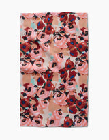 The Lucia Tea Towel by Ania Zwara Art features a vibrant abstract floral design in red, pink, and blue on a light background, crafted with Geoweave™ fabric for excellent absorbency and durability.