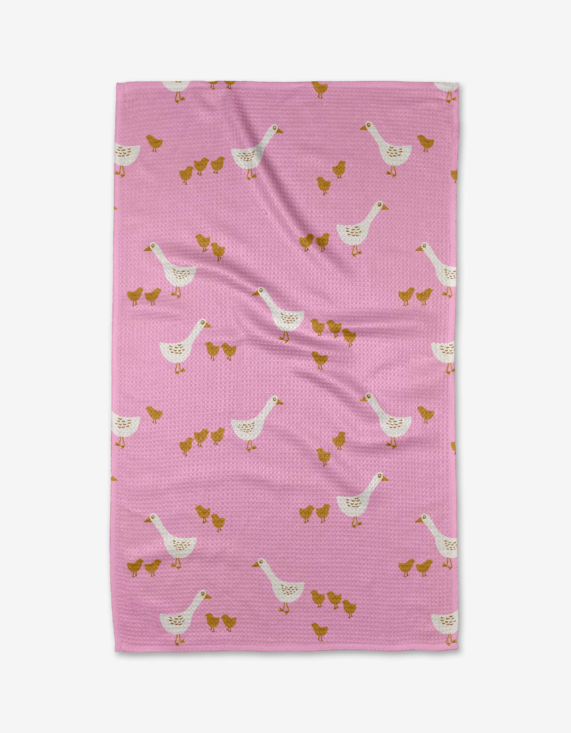 The Mallory blanket by Amy MacCready is pink, made from recycled materials, and features white ducks with groups of small yellow ducklings scattered across the surface.
